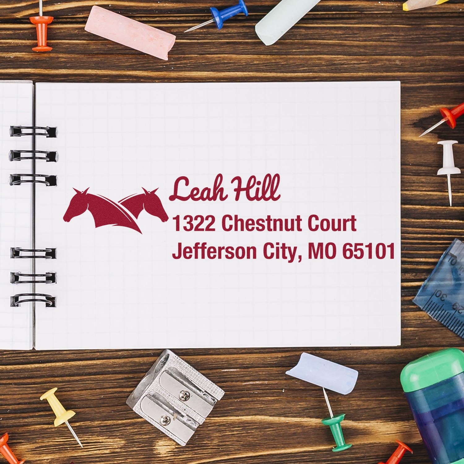 Personalized rubber stamp with horse logo and return address for Leah Hill, Jefferson City, MO 65101.