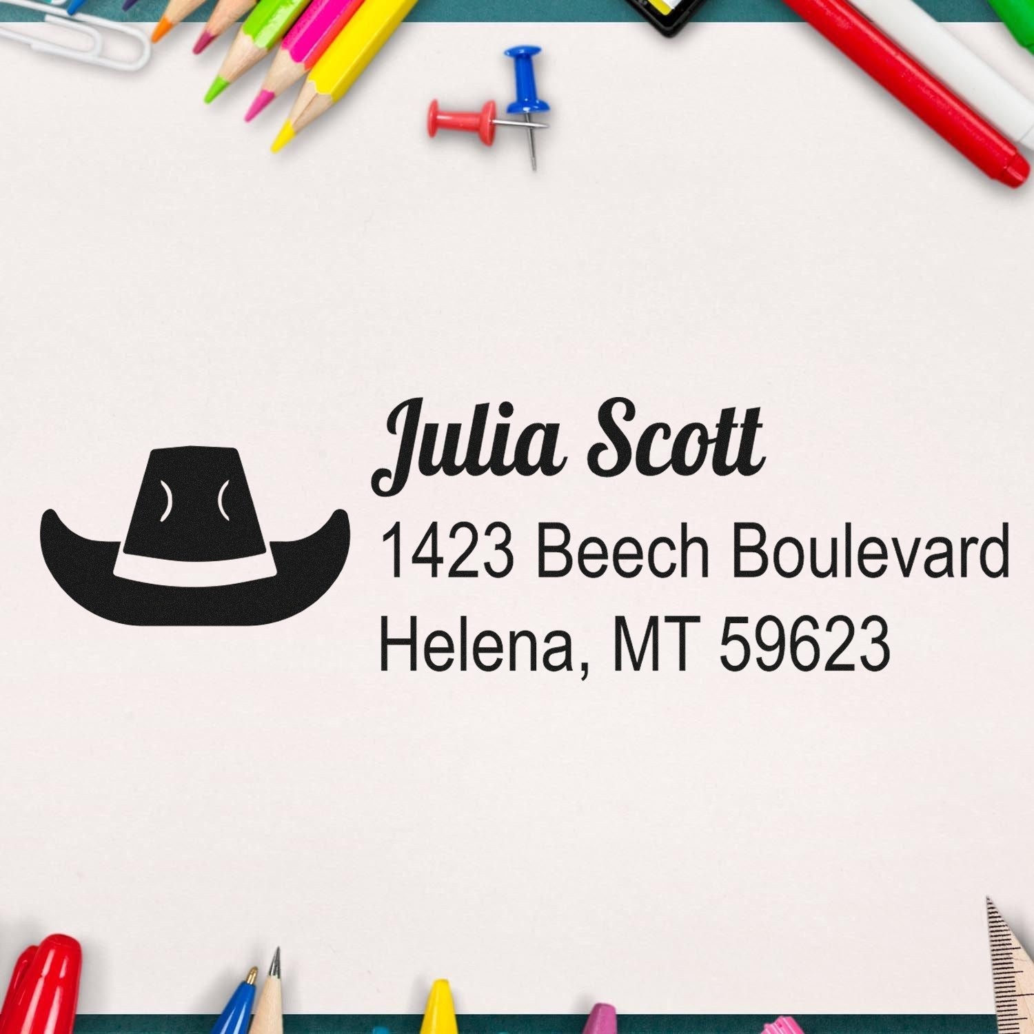 Custom western address rubber stamp with cowboy hat logo and personalized return address.