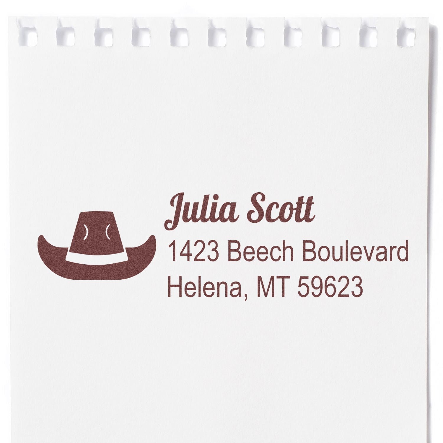 Custom return address rubber stamp with cowboy hat icon for Julia Scott, 1423 Beech Boulevard, Helena, MT 59623
