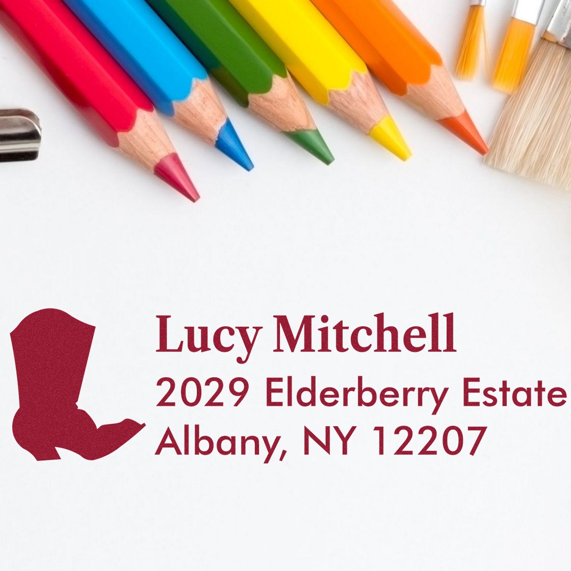 Custom return address rubber stamp with name and Albany, NY address for personalized stationery.