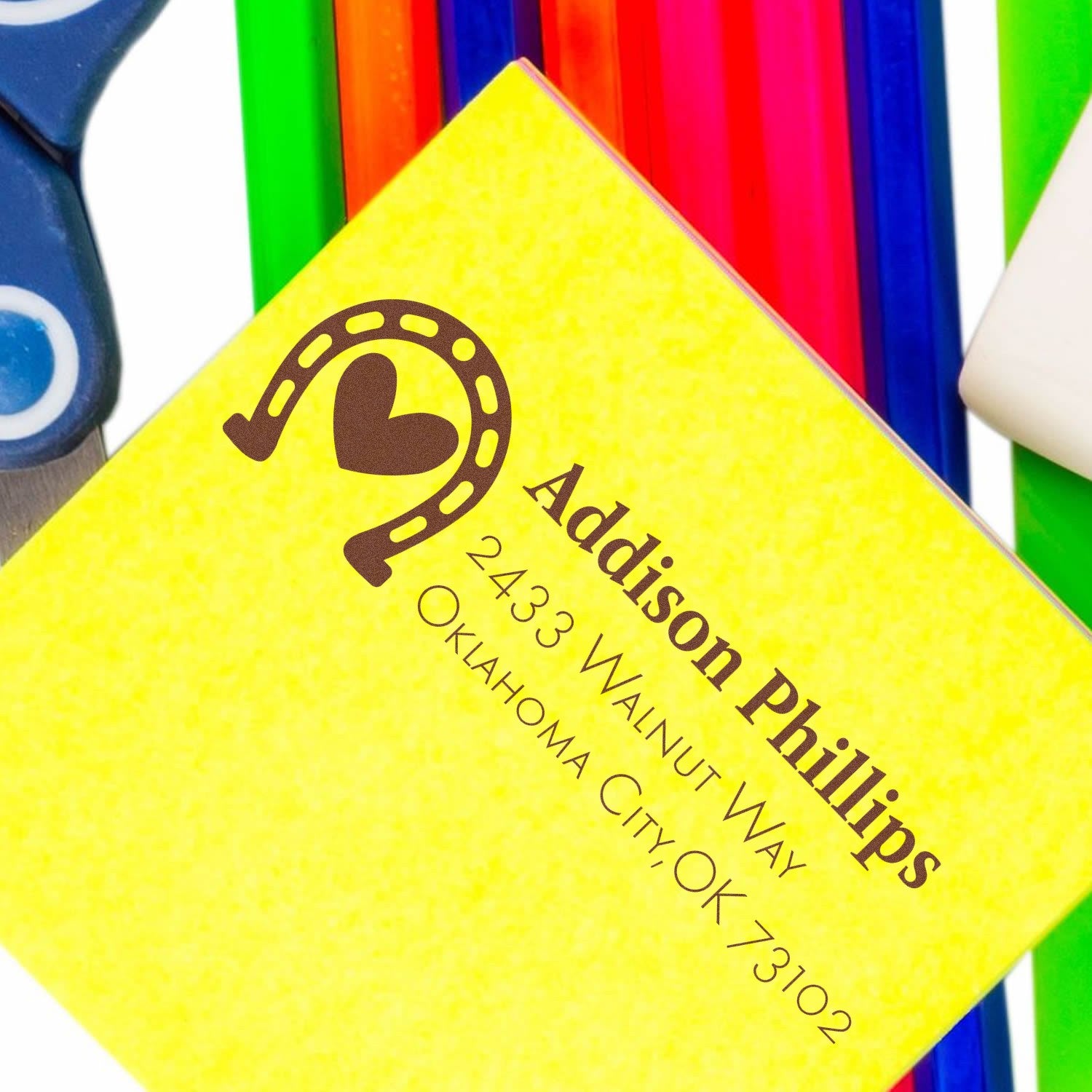 Custom rubber address stamp impression for Addison Phillips, Oklahoma City, OK 73102, on a yellow card.