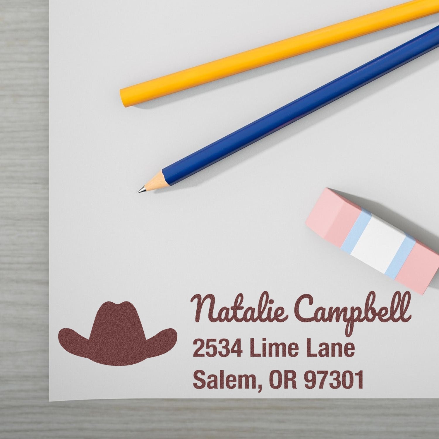 Custom return address rubber stamp for Natalie Campbell, Salem, OR, with cowboy hat design on stationery mockup