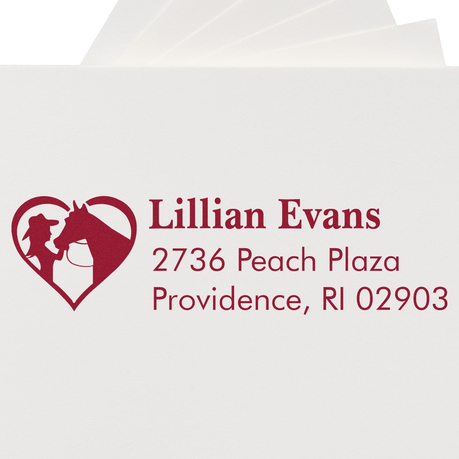 Custom rubber stamp with equestrian heart logo and return address for Lillian Evans, Providence, RI 02903.