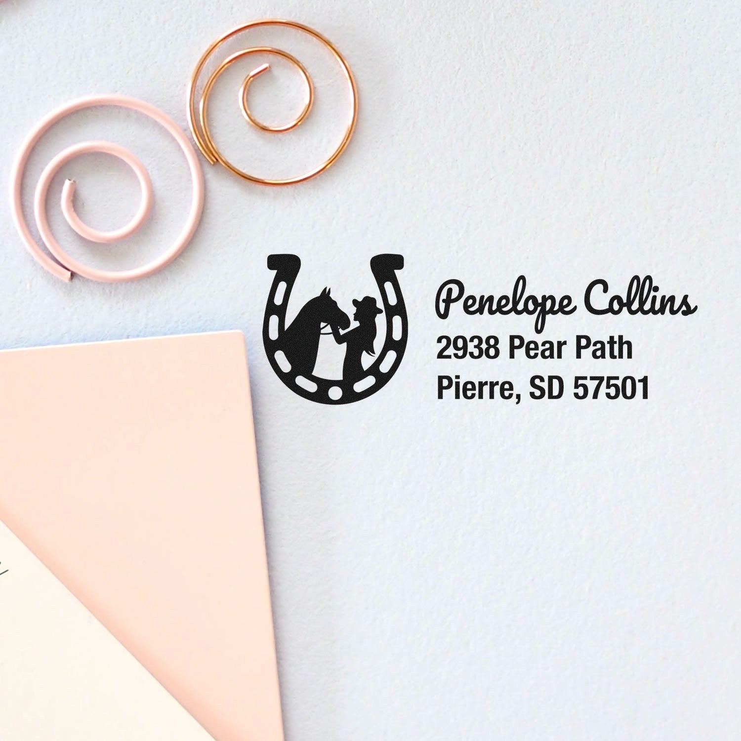 Personalized horse return address rubber stamp with horseshoe logo for Penelope Collins, Pierre, SD 57501.