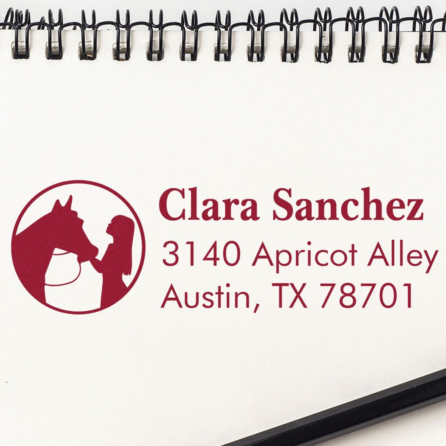 Custom horse logo address rubber stamp for Clara Sanchez, Austin TX, with name and mailing address imprint.