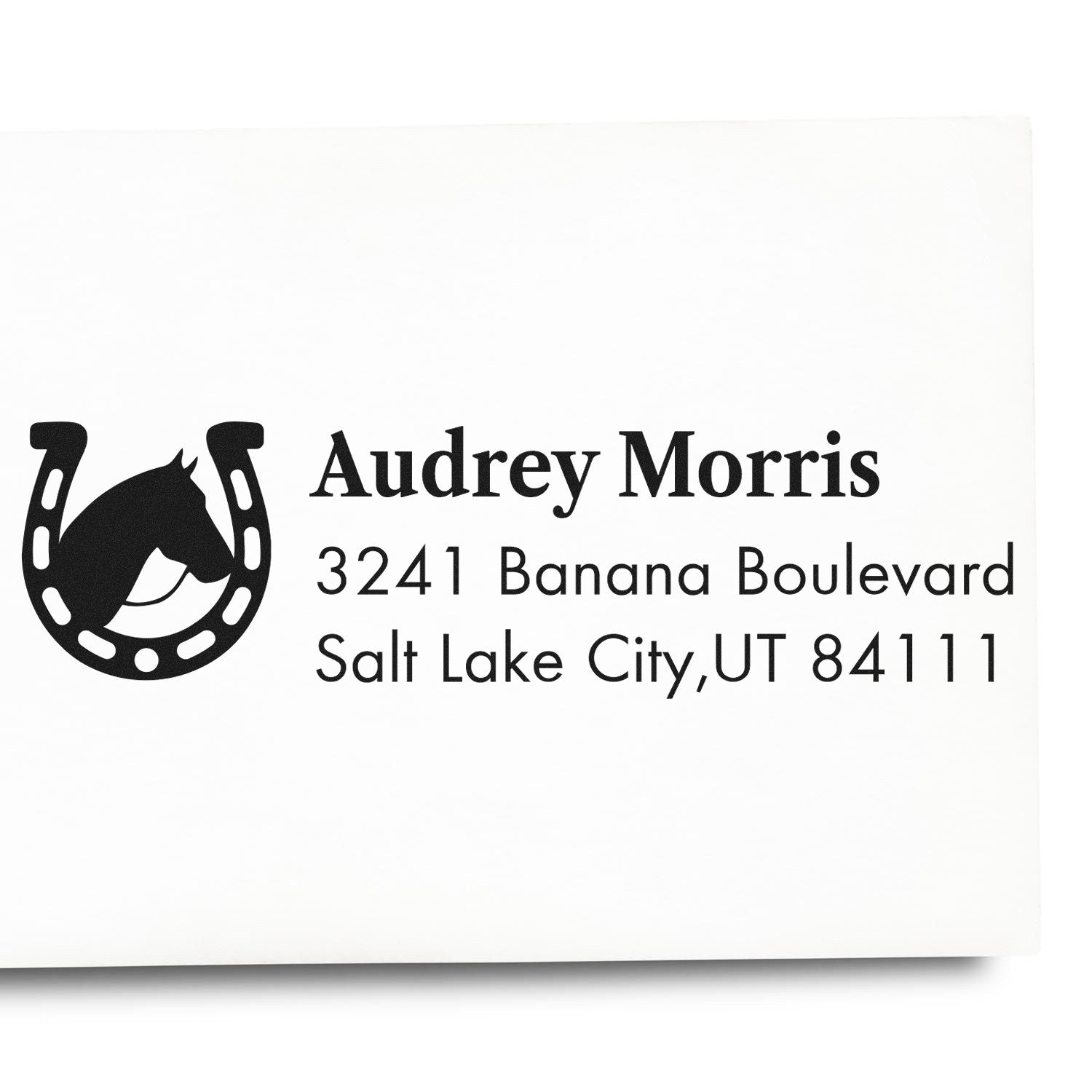 Personalized rubber address stamp with horseshoe logo for Audrey Morris, Salt Lake City, UT 84111.