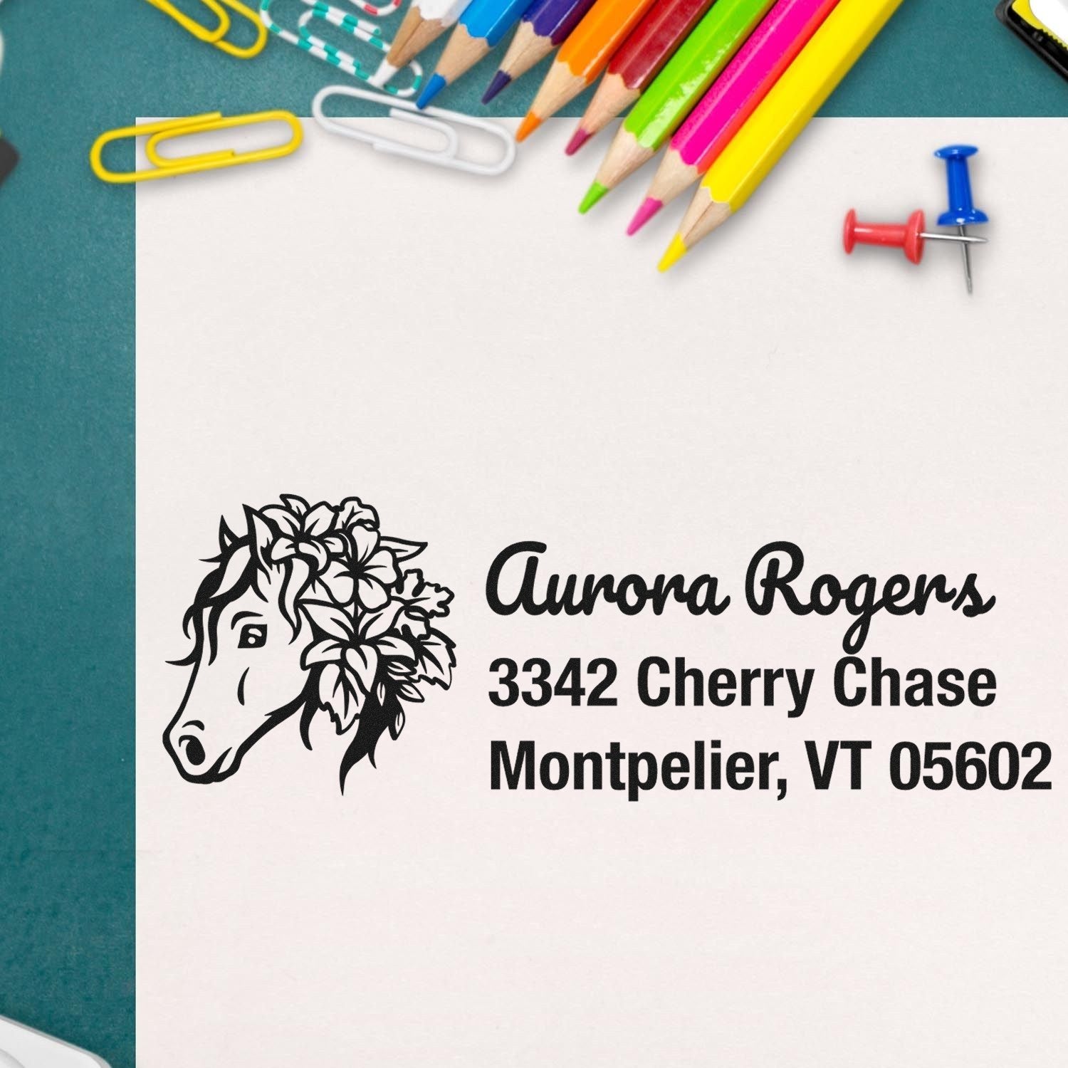 Custom equestrian address rubber stamp for Aurora Rogers in Montpelier, VT with floral horse logo.