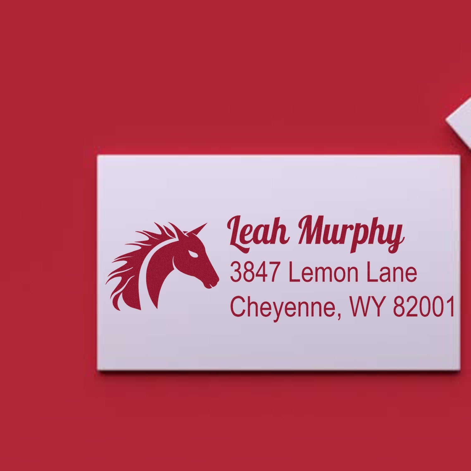 Custom address rubber stamp with horse logo for Leah Murphy, 3847 Lemon Lane, Cheyenne, WY 82001.
