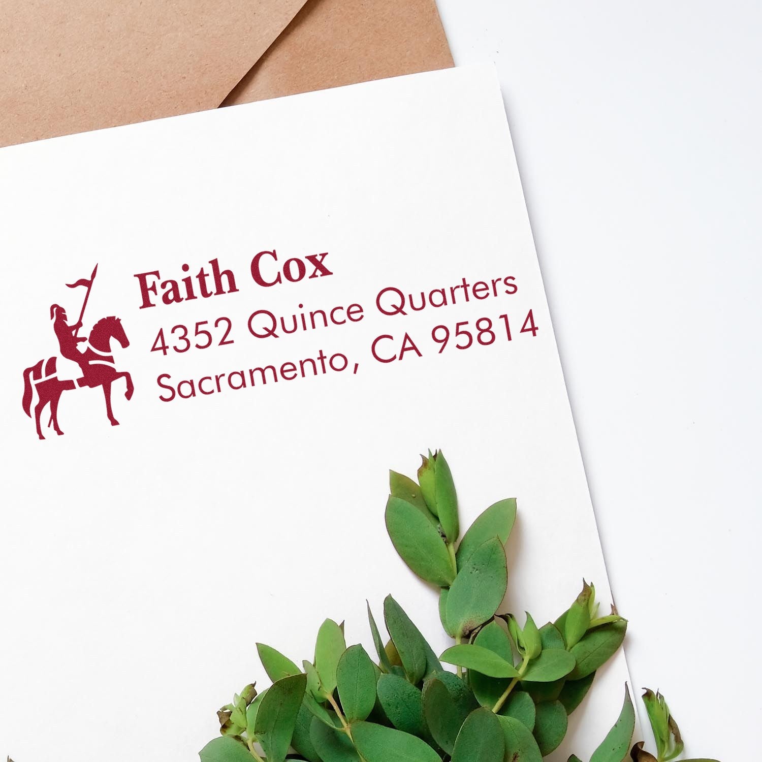 Custom return address rubber stamp on white envelope with horse rider logo, Faith Cox, Sacramento, CA address.