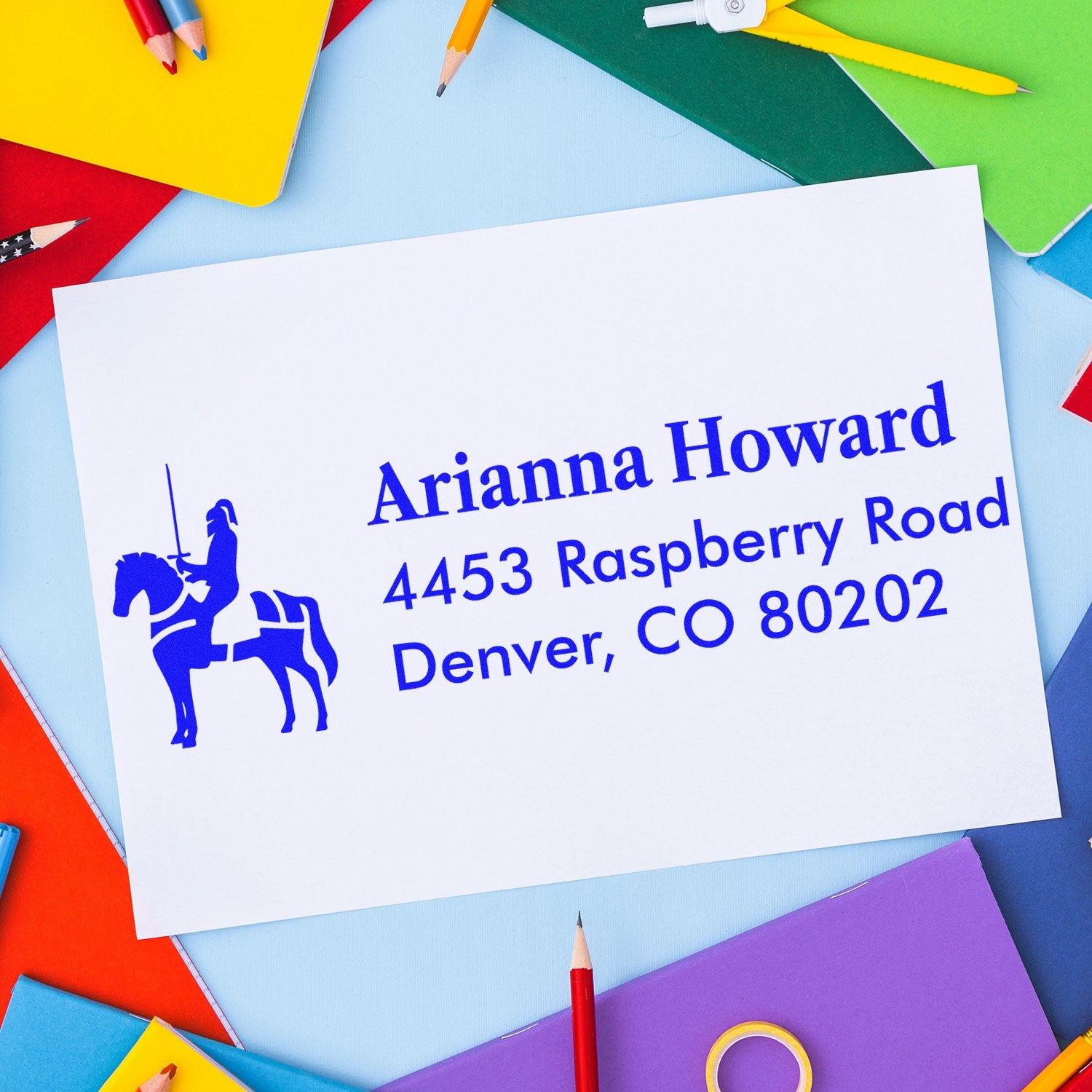Custom personalized rubber address stamp with equestrian logo for Arianna Howard, Denver CO 80202, on a white envelope.