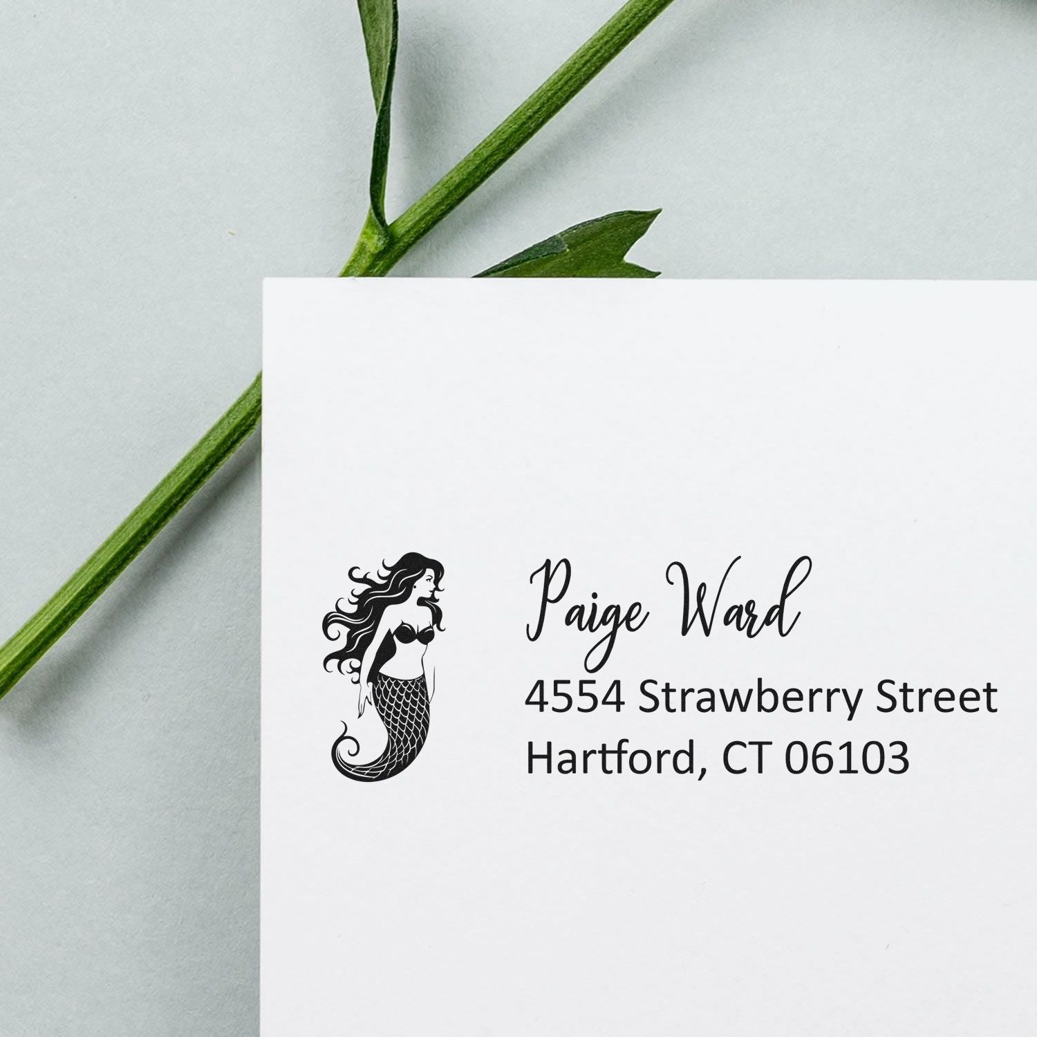 Custom mermaid address rubber stamp on envelope, featuring personalized name and Hartford, CT mailing address.
