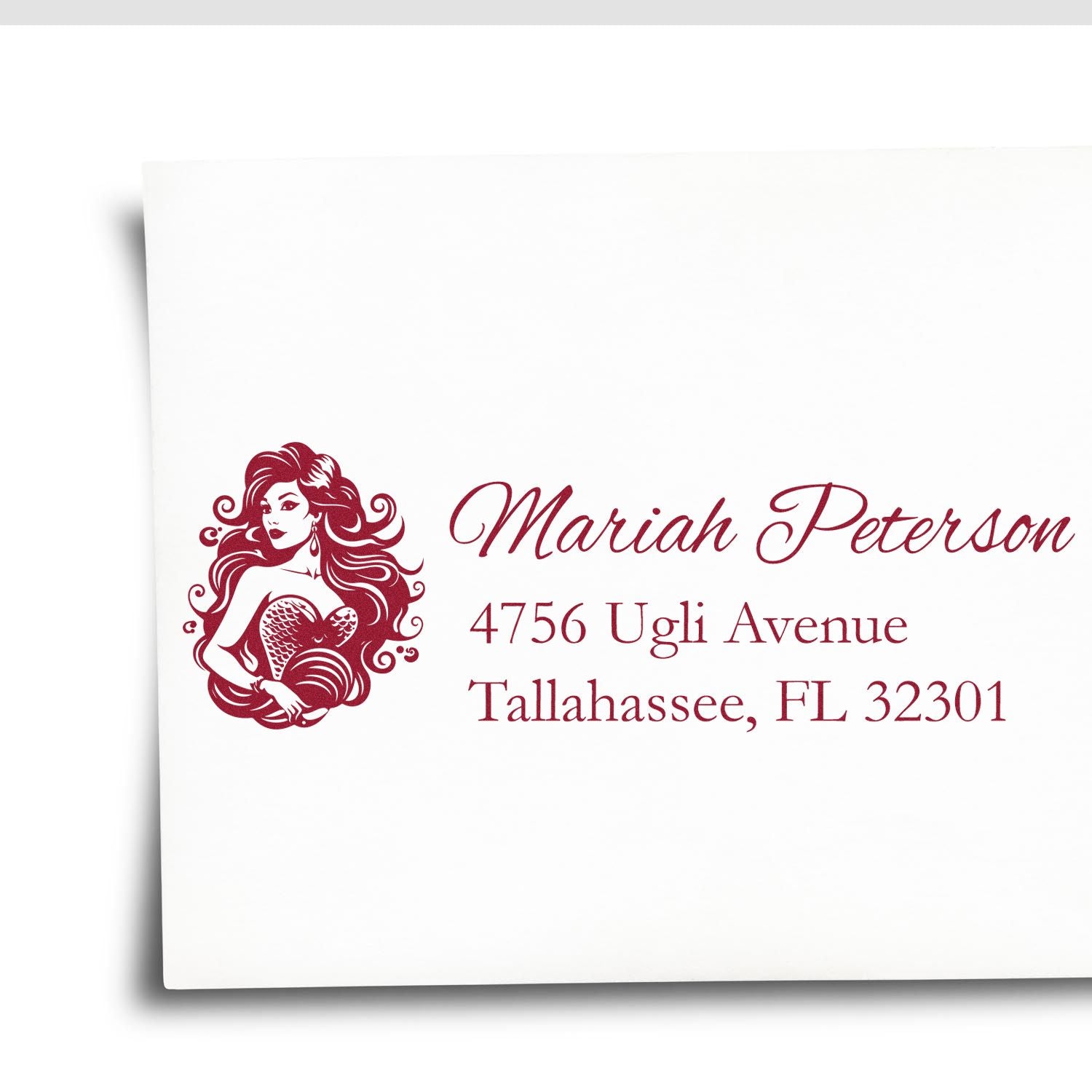 Custom return address rubber stamp with mermaid monogram for Mariah Peterson, Tallahassee, FL.