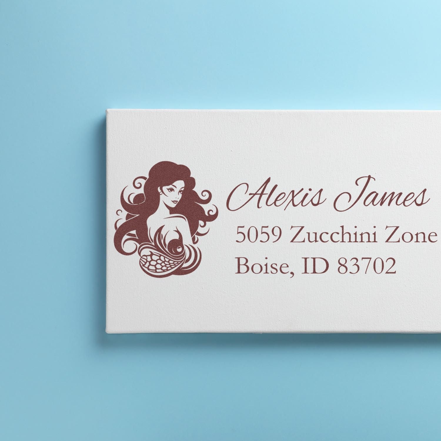 Personalized mermaid address rubber stamp for Alexis James, featuring name and Boise, Idaho mailing details.