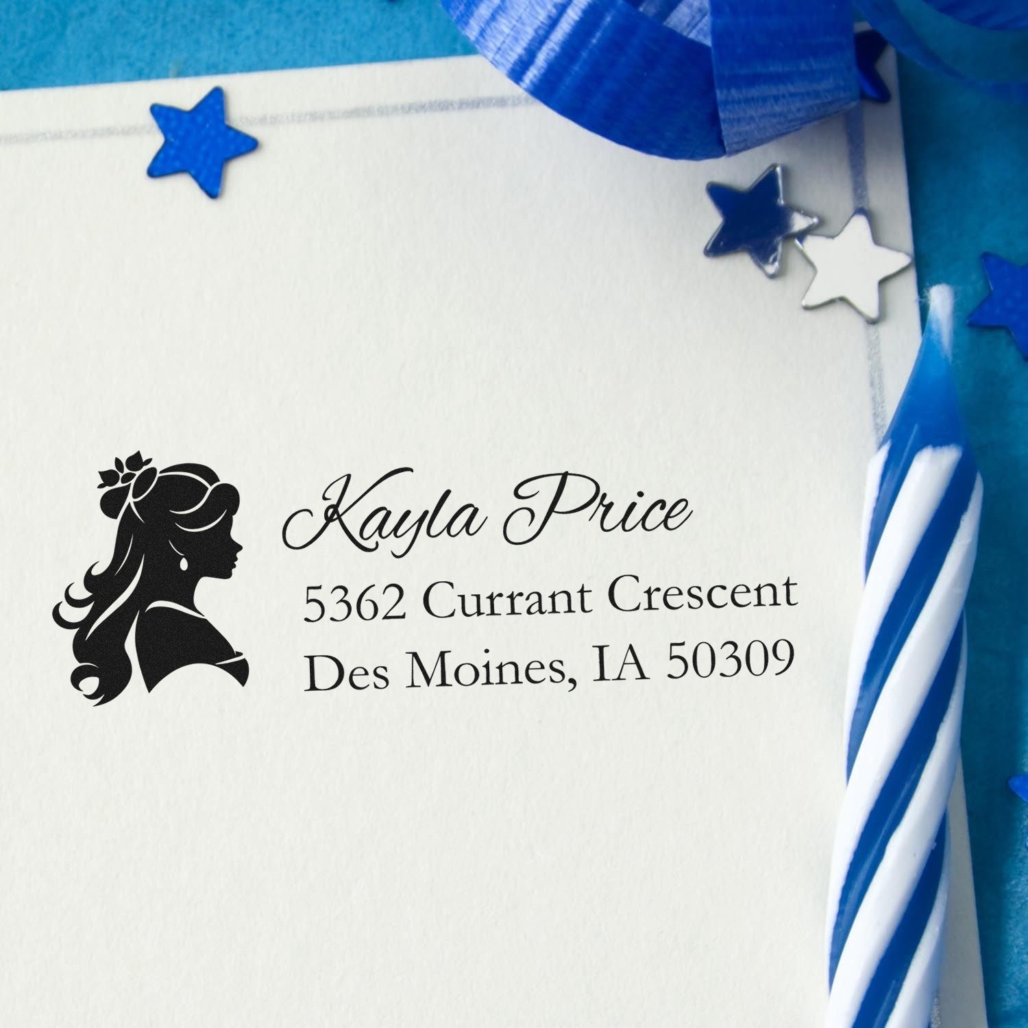 Custom return address rubber stamp featuring a lady silhouette, stamped on a white envelope with blue star birthday decor.