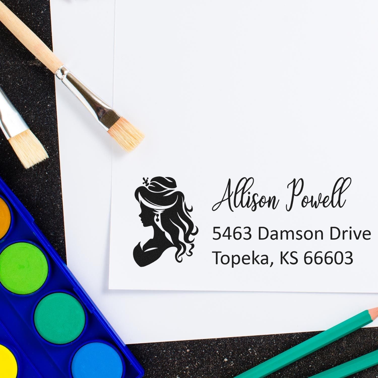 Custom rubber stamp with woman silhouette logo and Allison Powell return address for personalized mailing and craft branding.