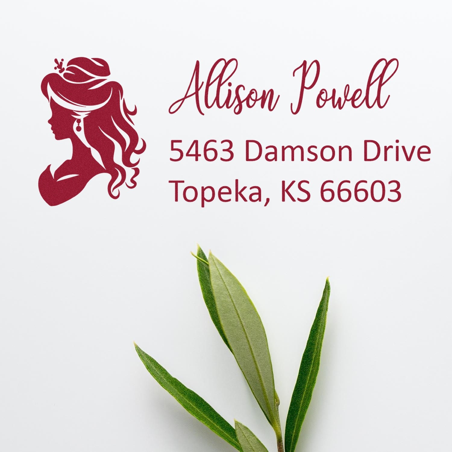 Personalized rubber return address stamp with woman silhouette logo for Allison Powell, Topeka, KS 66603.