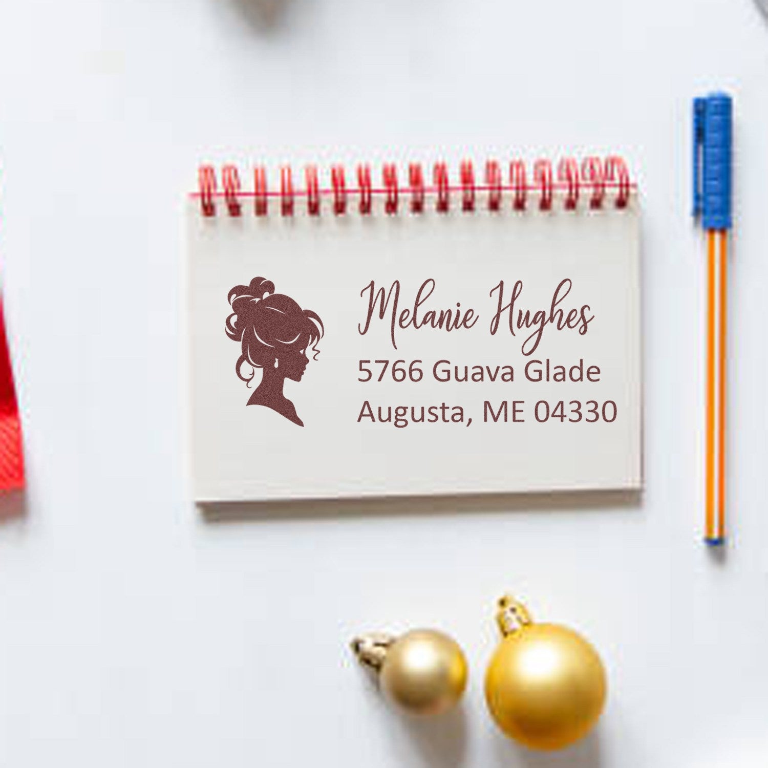 Custom return address rubber stamp with feminine silhouette, name, and mailing address for personalized envelopes and stationery.