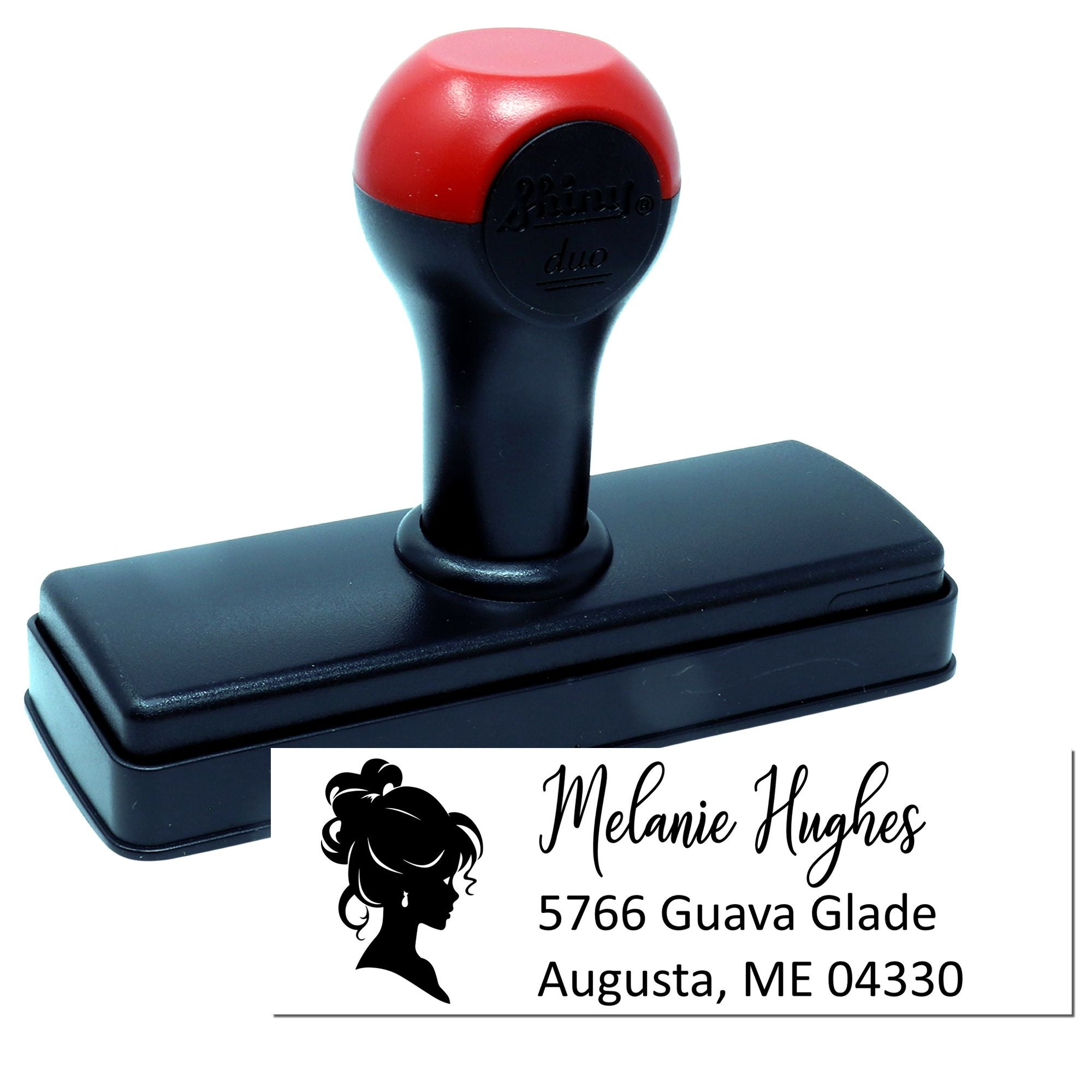 Personalized self-inking rubber address stamp with name and return address for envelopes and business mail.