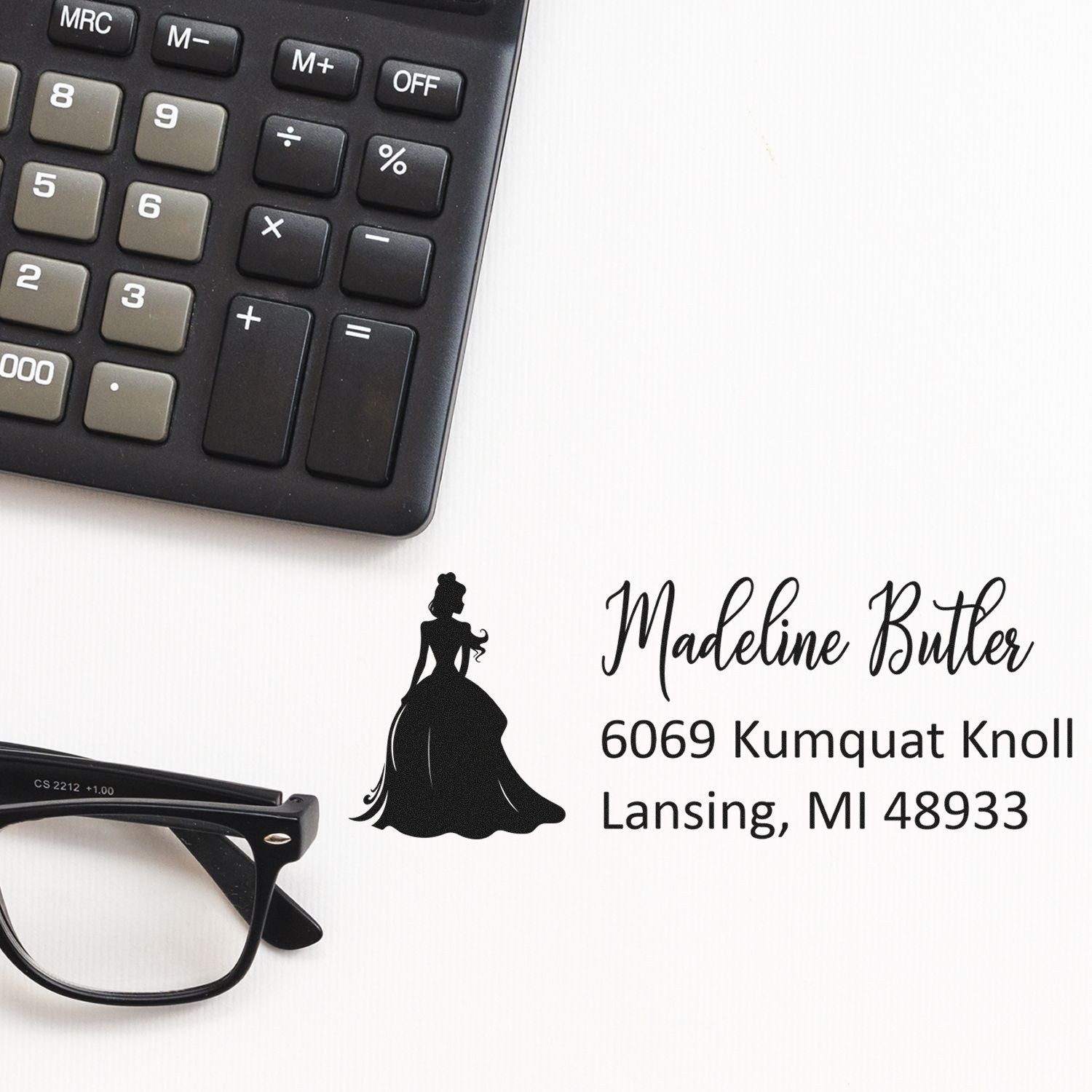 Custom rubber return address stamp with name, Lansing, MI address, and elegant silhouette logo for business mailing.