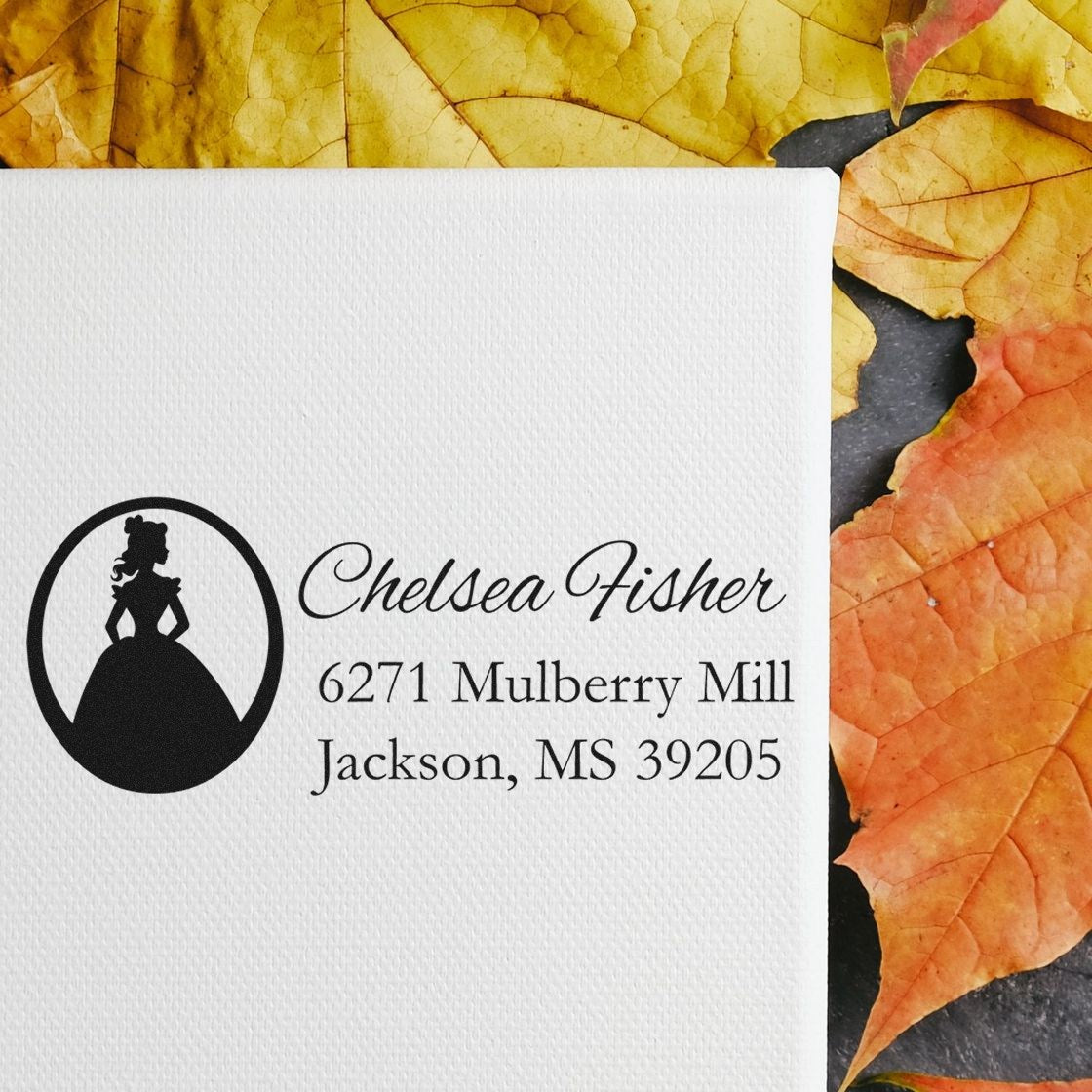Custom return address rubber stamp with elegant woman silhouette logo, personalized name and address on autumn leaves background.