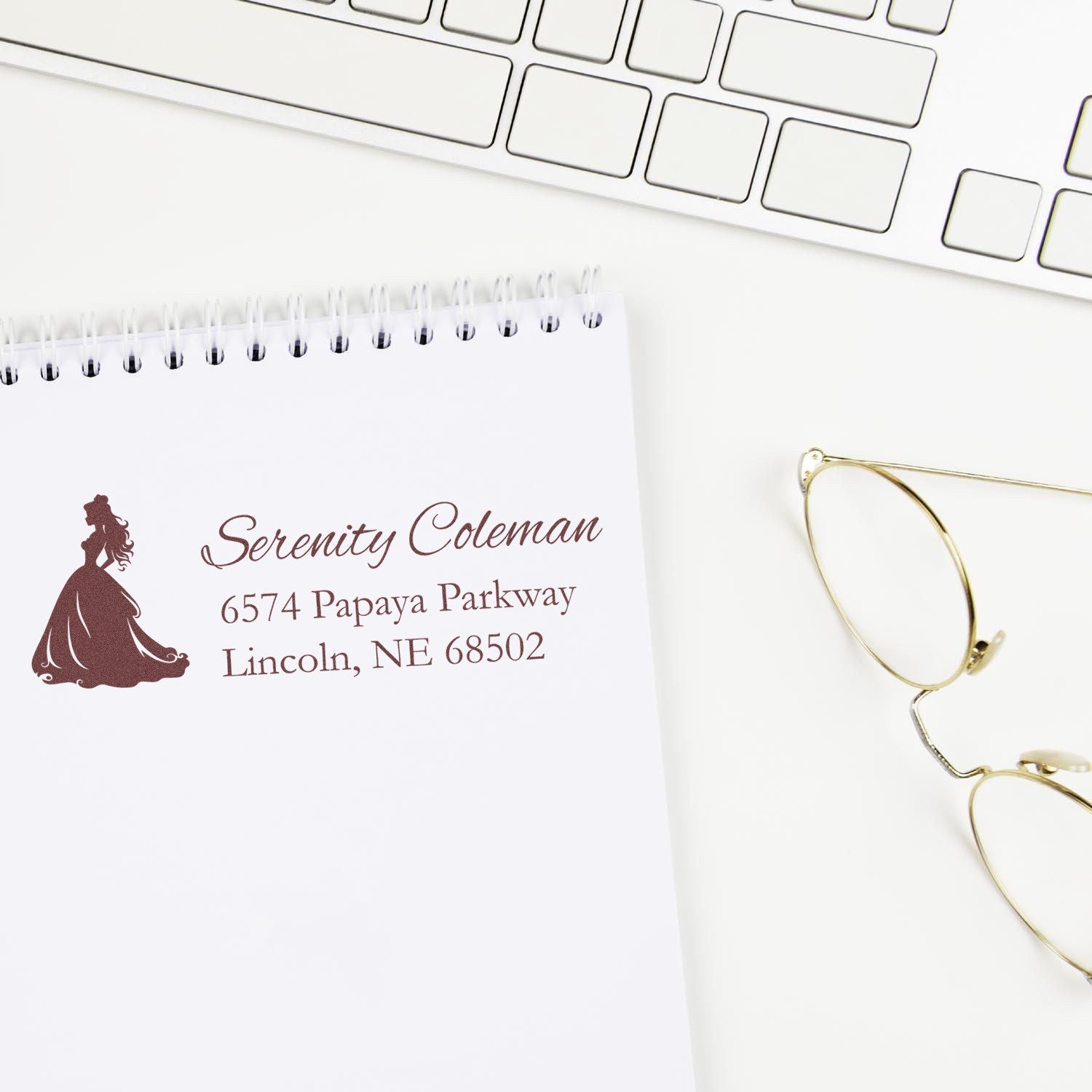Custom address rubber stamp with princess silhouette, name, and Lincoln, NE return address for stationery