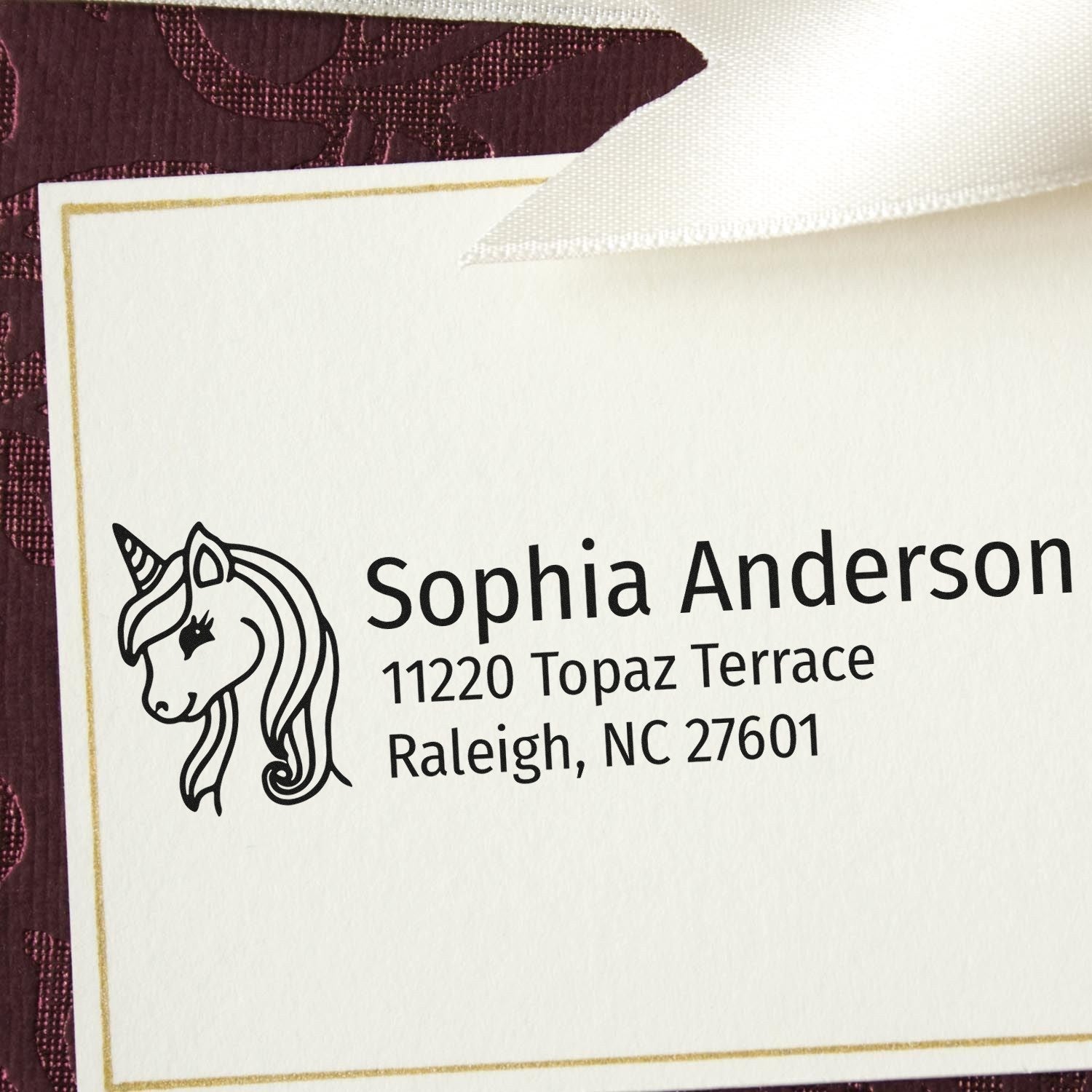 Custom unicorn return address rubber stamp for Sophia Anderson, Raleigh, NC, on personalized stationery.
