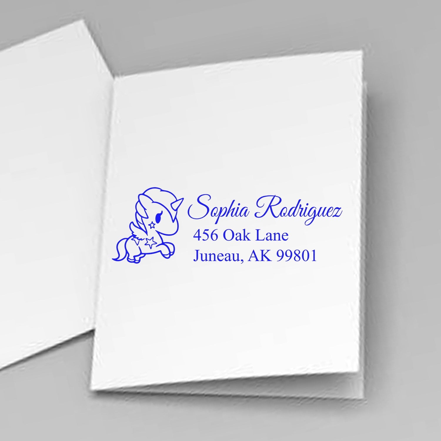 Personalized unicorn rubber stamp with Sophia Rodriguez name and Juneau, AK 99801 address for custom return envelopes.