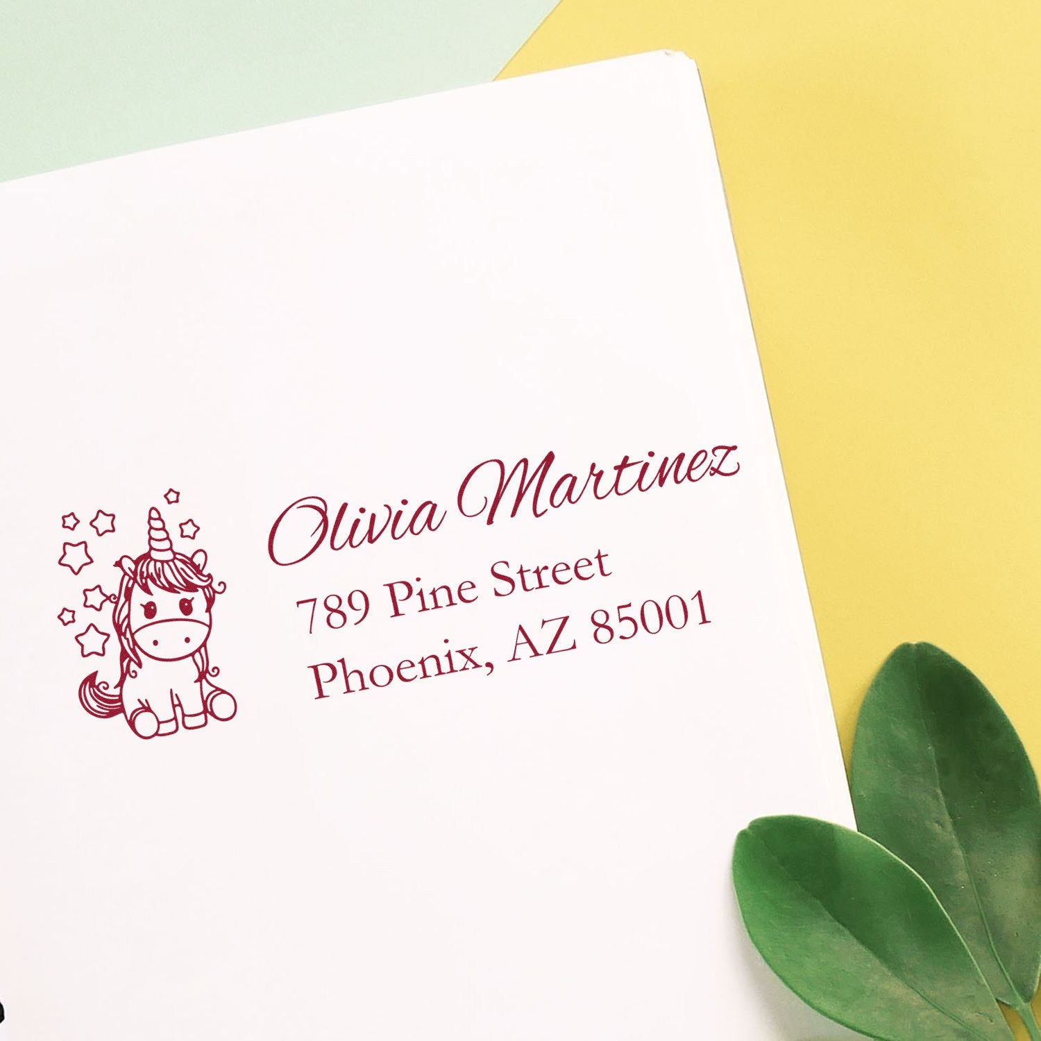 Personalized unicorn address rubber stamp for Olivia Martinez, 789 Pine Street, Phoenix, AZ 85001.