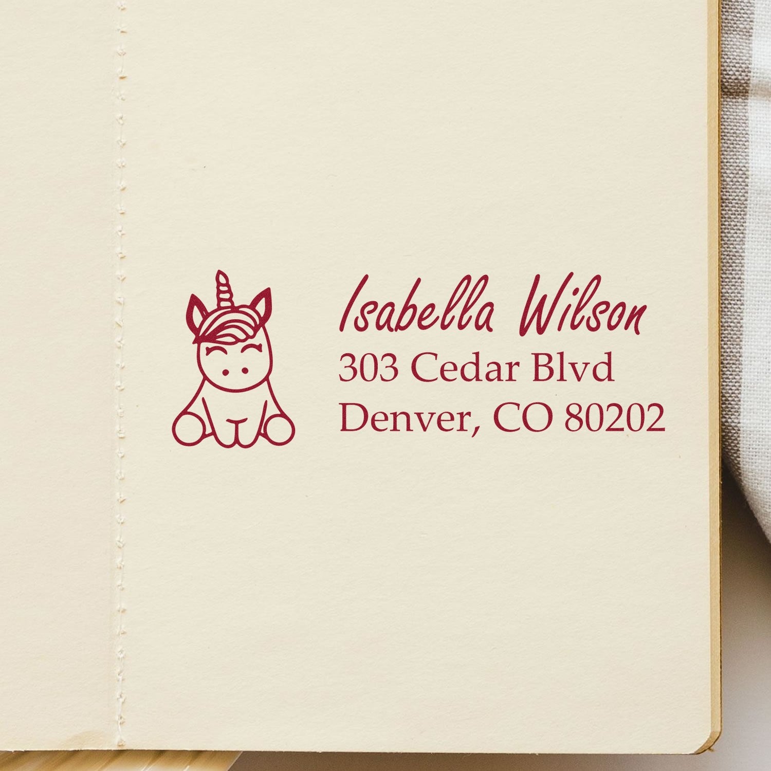 Custom unicorn return address rubber stamp with name and Denver, CO mailing address for envelopes.