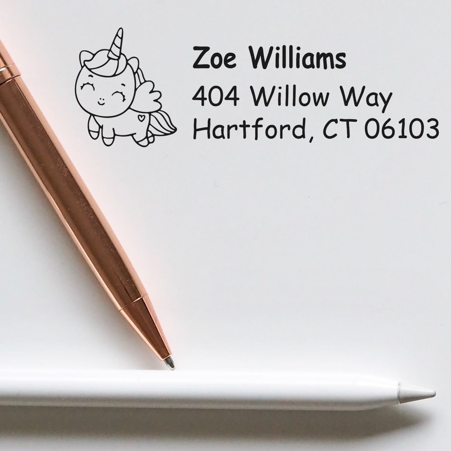 Custom unicorn address rubber stamp with name and Hartford, CT mailing address for personalized stationery.