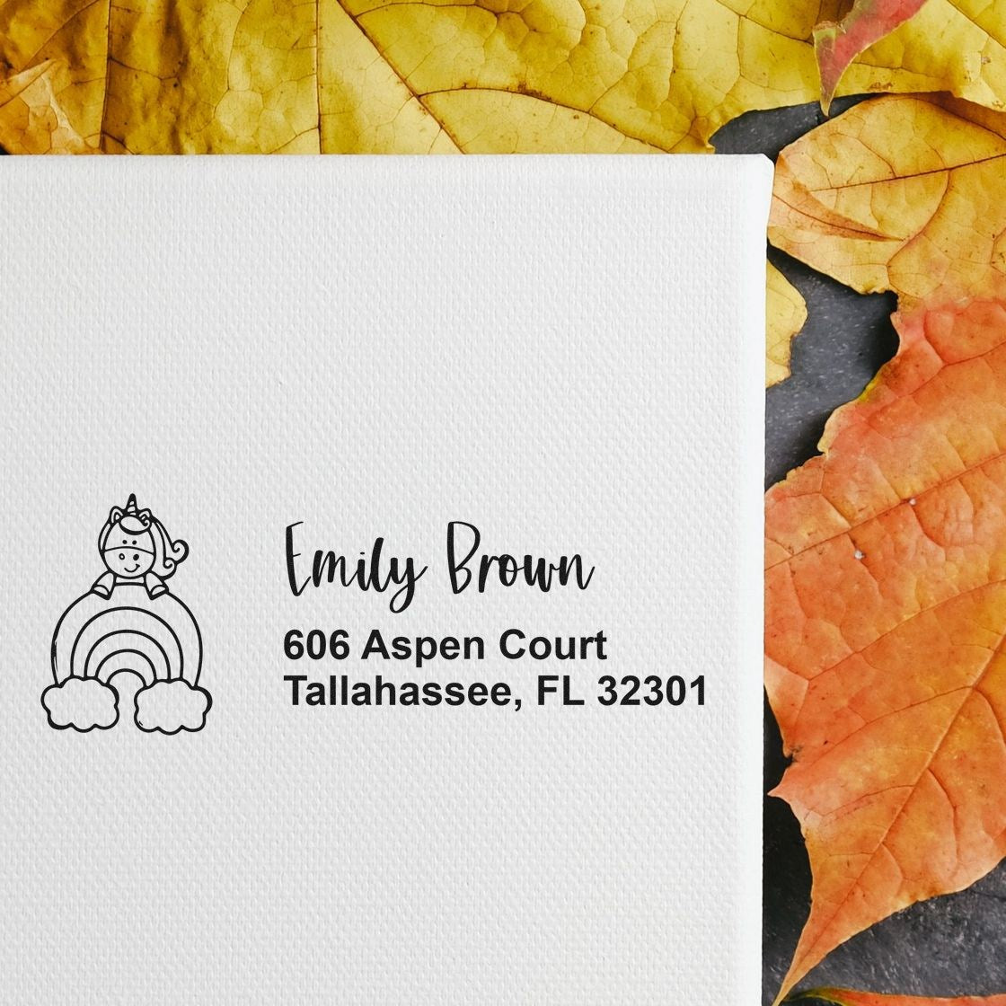 Custom unicorn address stamp for Emily Brown, featuring return address 606 Aspen Court, Tallahassee, FL.