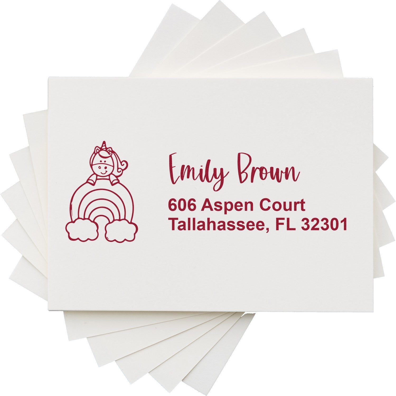 Custom rubber return address stamp with unicorn rainbow design for Emily Brown, Tallahassee, FL 32301