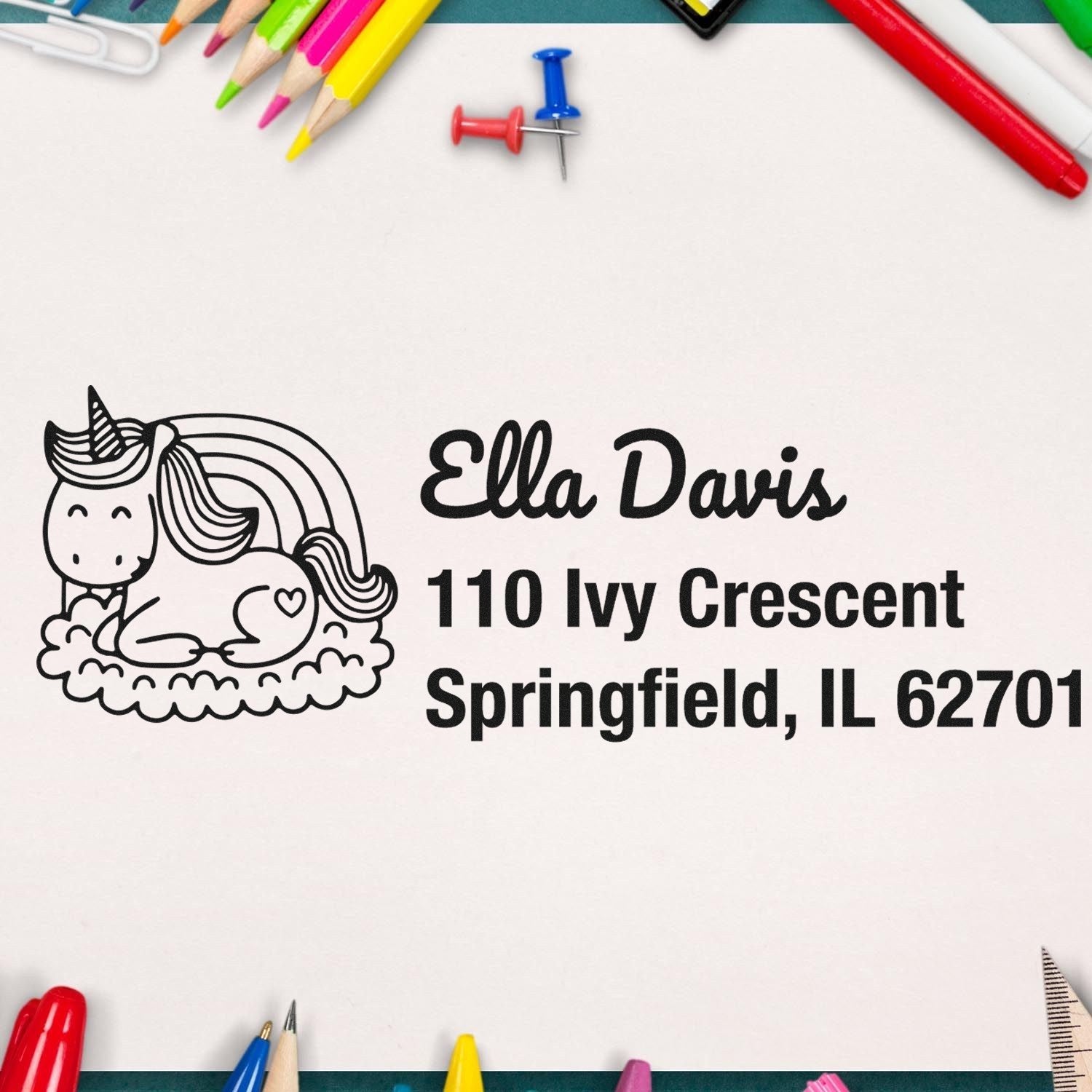Custom rubber address stamp with unicorn design, featuring Ella Davis return address in Springfield, IL.