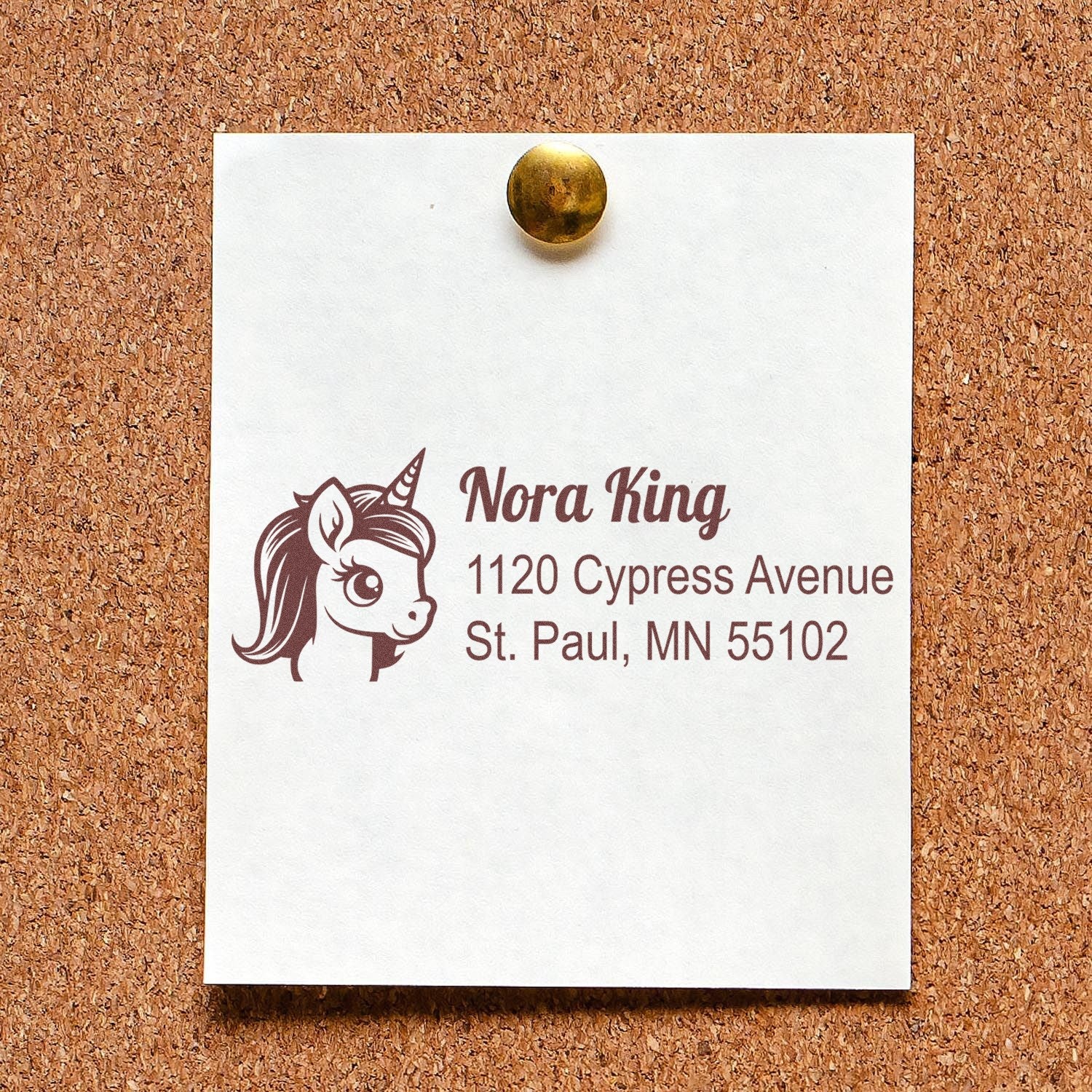 Custom unicorn return address rubber stamp with name and St. Paul, MN address on pinned note.