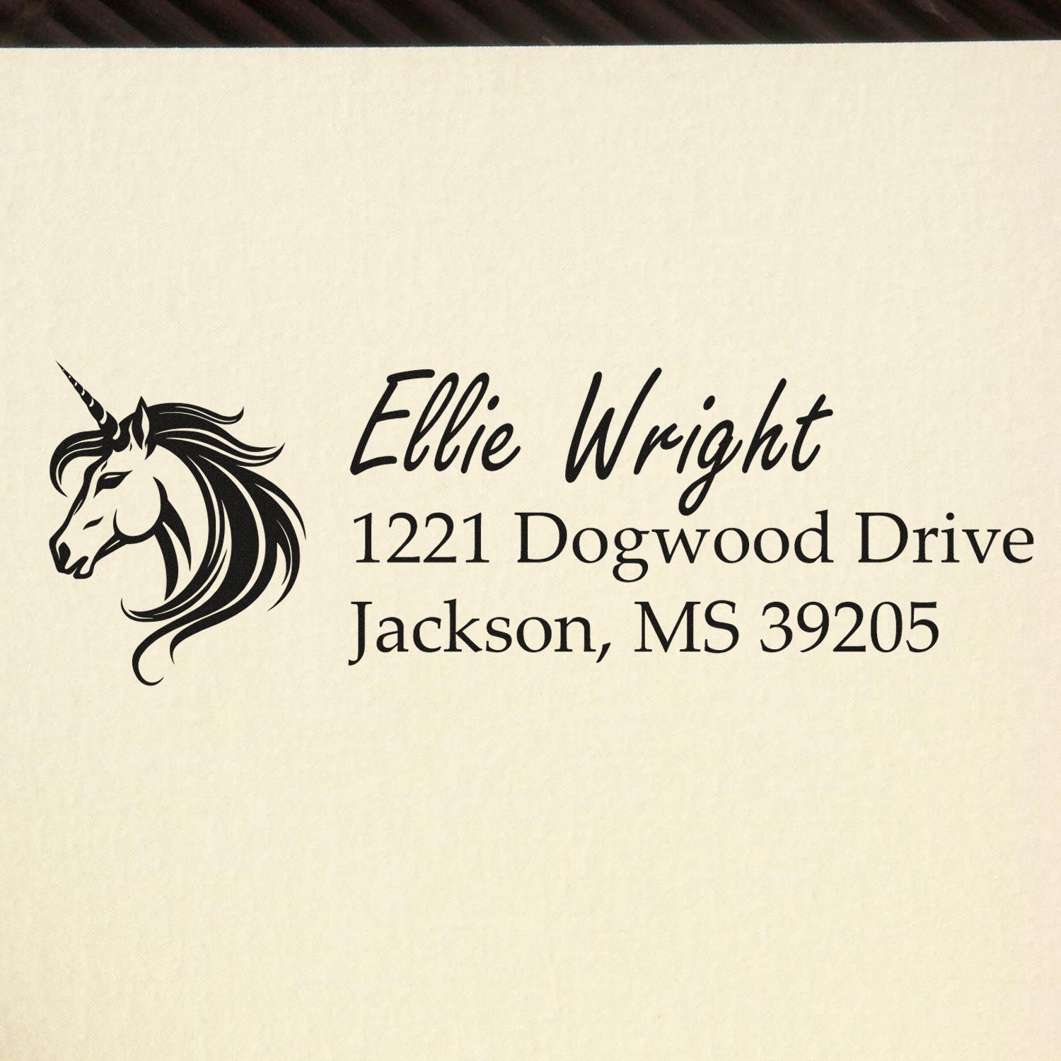 Custom unicorn address rubber stamp for Ellie Wright, 1221 Dogwood Drive, Jackson, MS 39205.