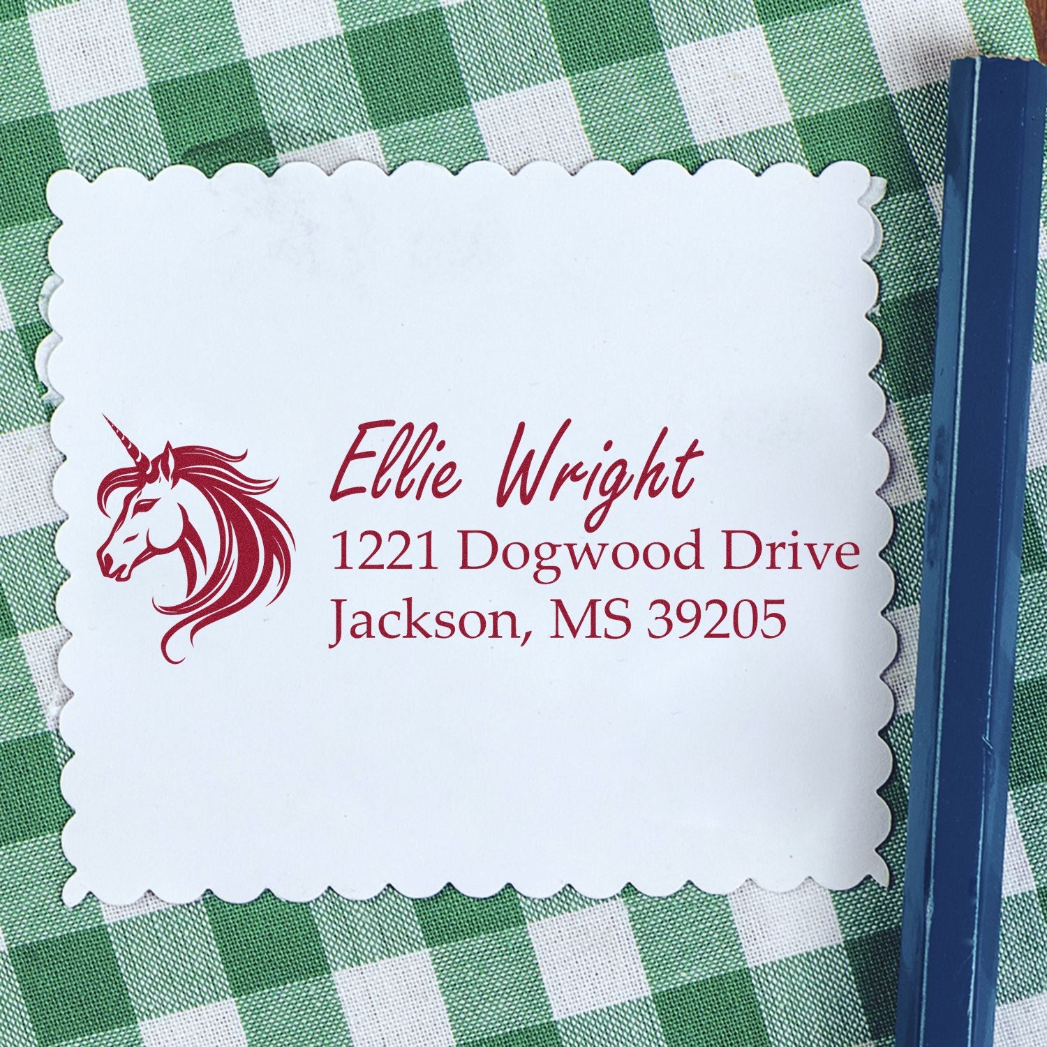 Personalized unicorn address rubber stamp with name, street address, city, and ZIP code on scalloped paper