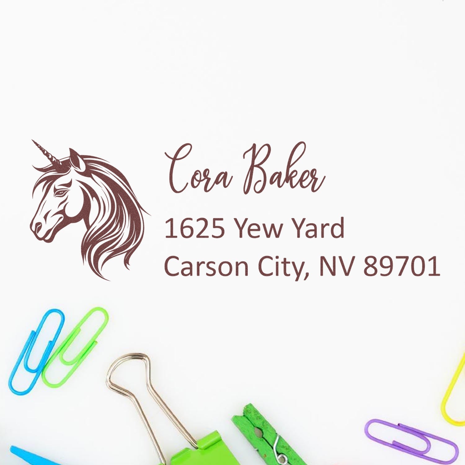 Personalized unicorn address rubber stamp for Cora Baker, 1625 Yew Yard, Carson City, NV 89701.