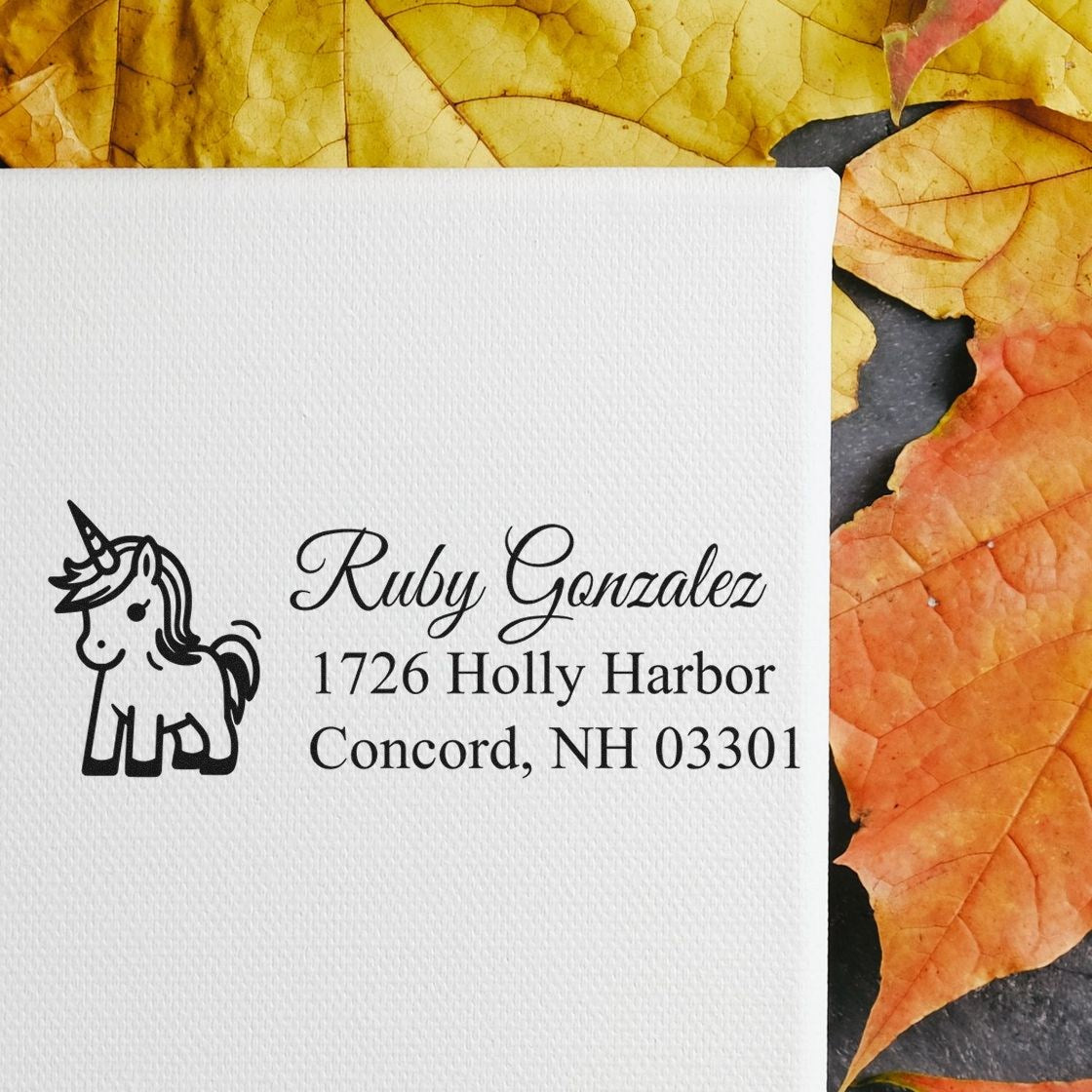 Personalized unicorn address rubber stamp with Ruby Gonzalez name and Concord, NH return address for envelopes.