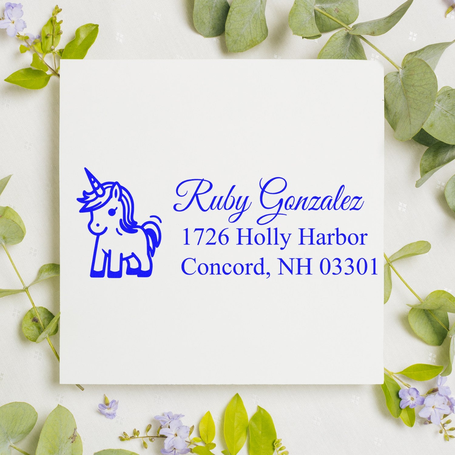 Personalized unicorn address rubber stamp with Ruby Gonzalez name and Concord, NH return address for mailing envelopes.