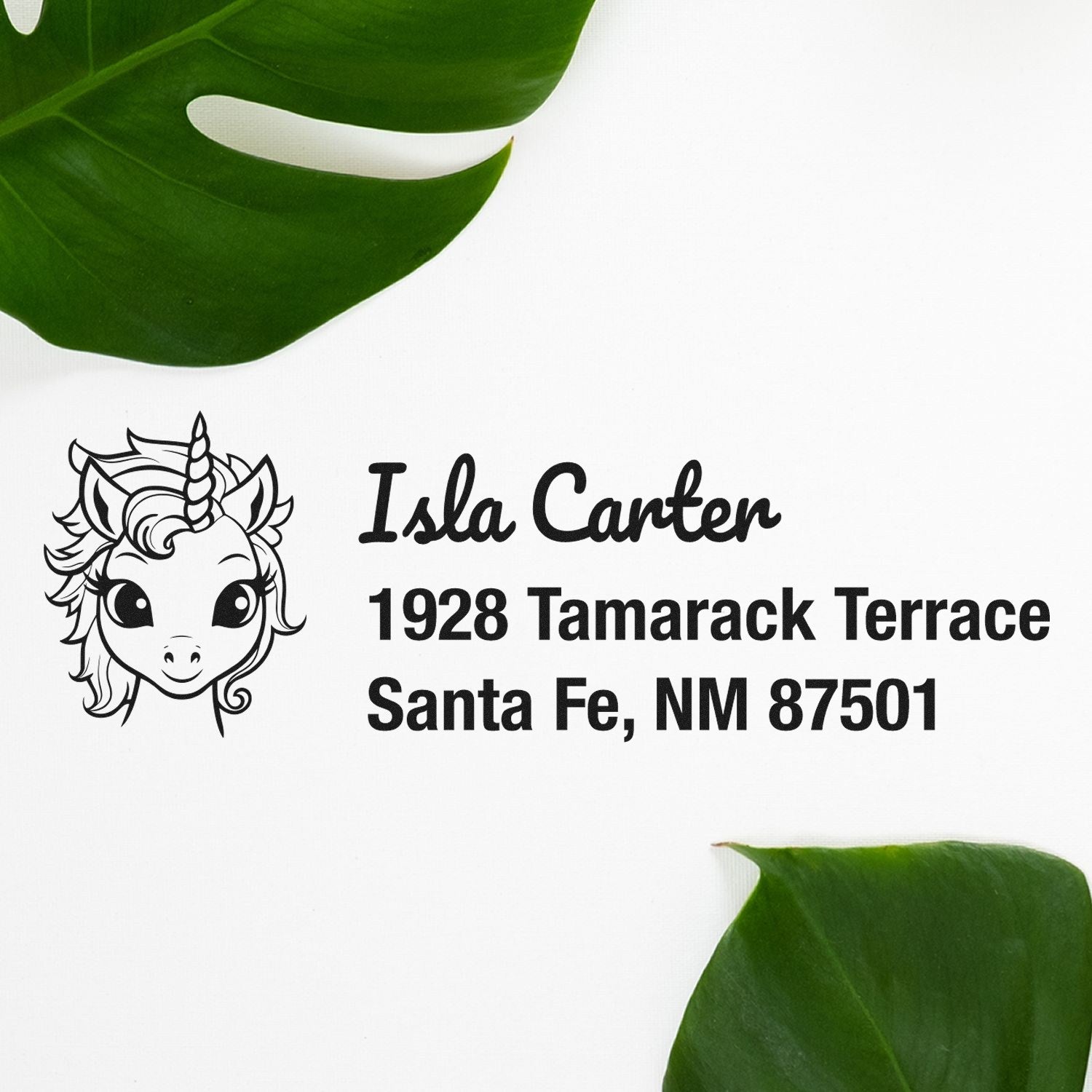 Custom unicorn address rubber stamp design for Isla Carter, 1928 Tamarack Terrace, Santa Fe, NM 87501.
