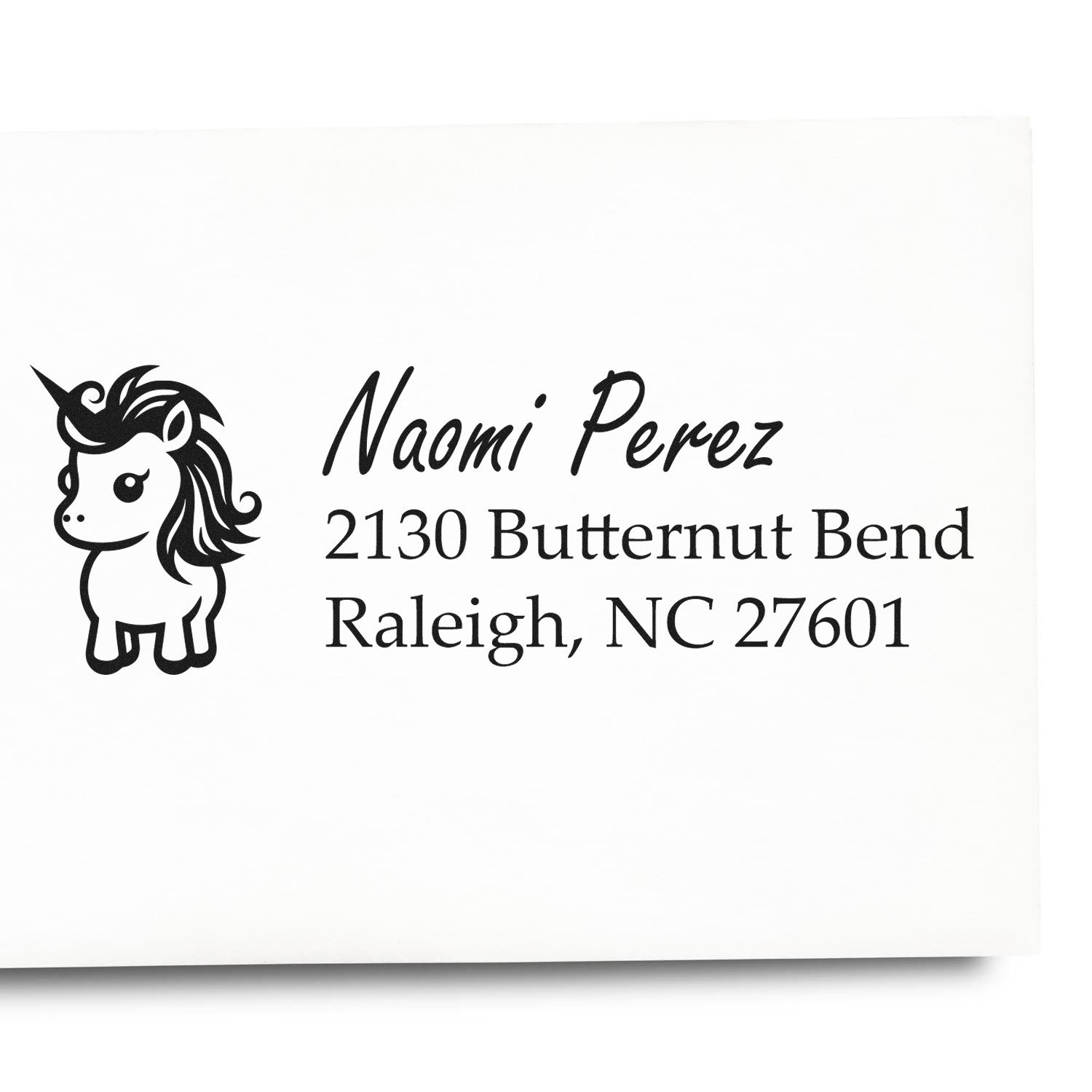 Personalized unicorn address rubber stamp for Naomi Perez, 2130 Butternut Bend, Raleigh, NC 27601.