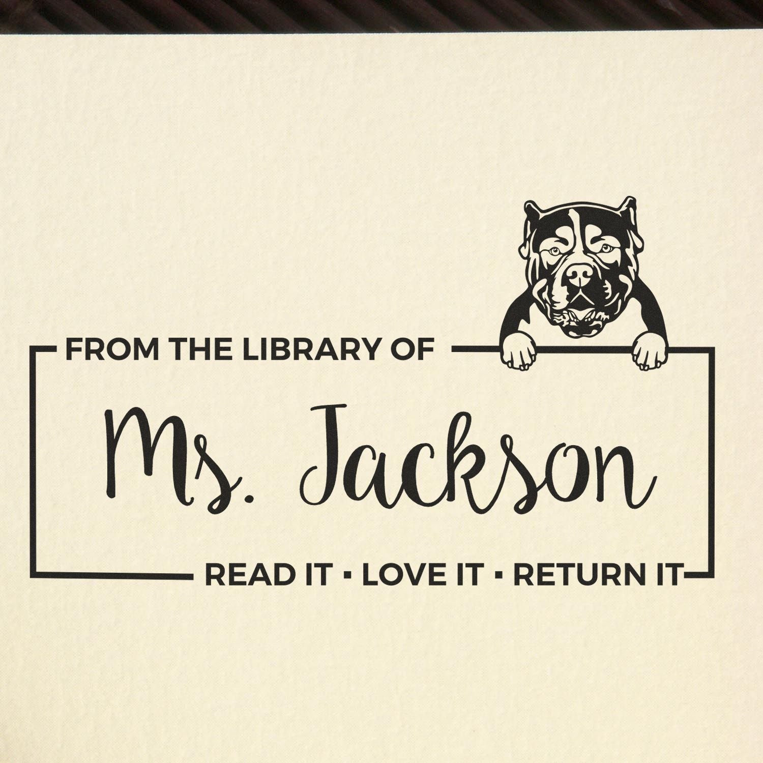 Personalized library book stamp with bulldog design for Ms. Jackson, featuring From the Library Of and return reminder text.