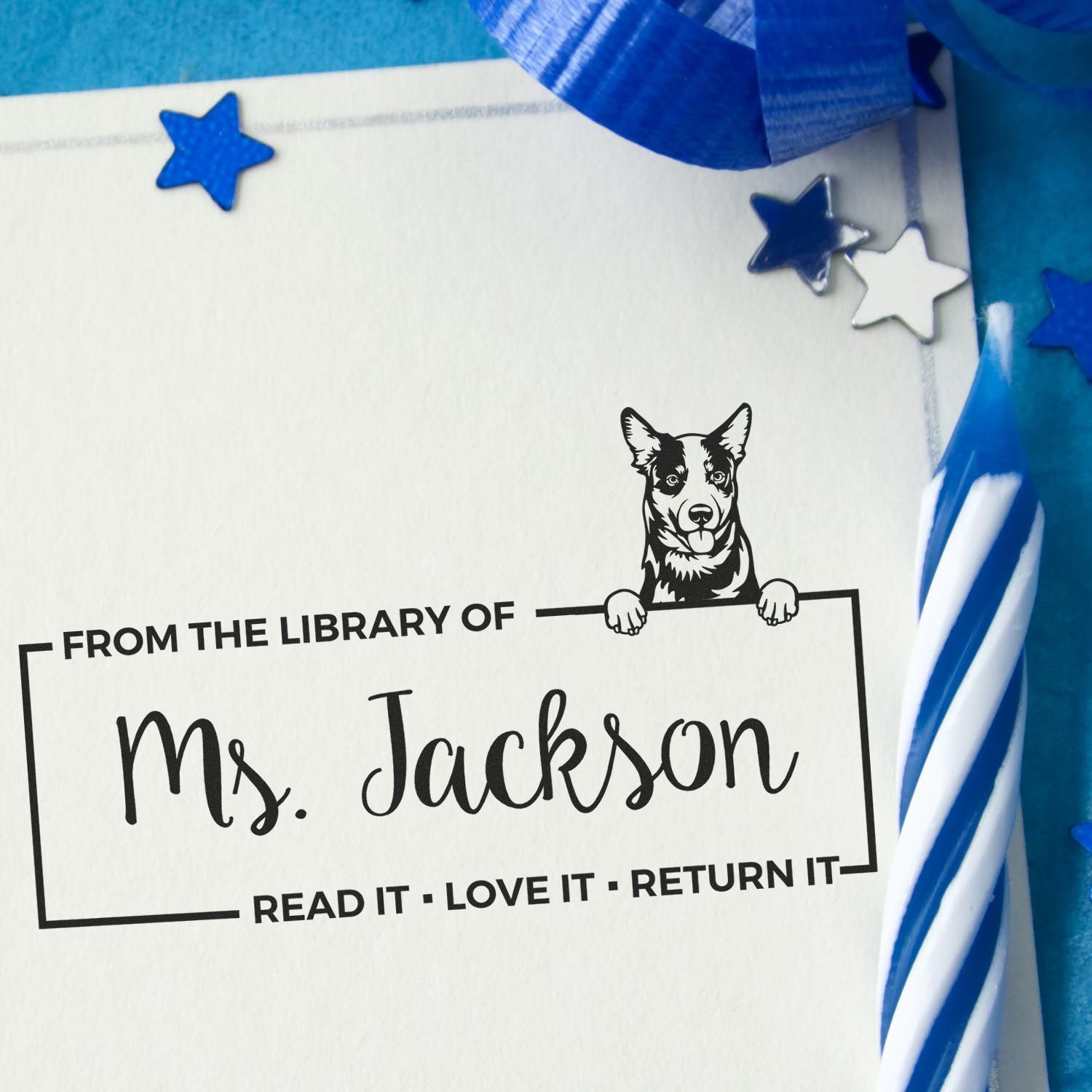 Custom library book stamp for Ms. Jackson with dog design and Read it, love it, return it message.