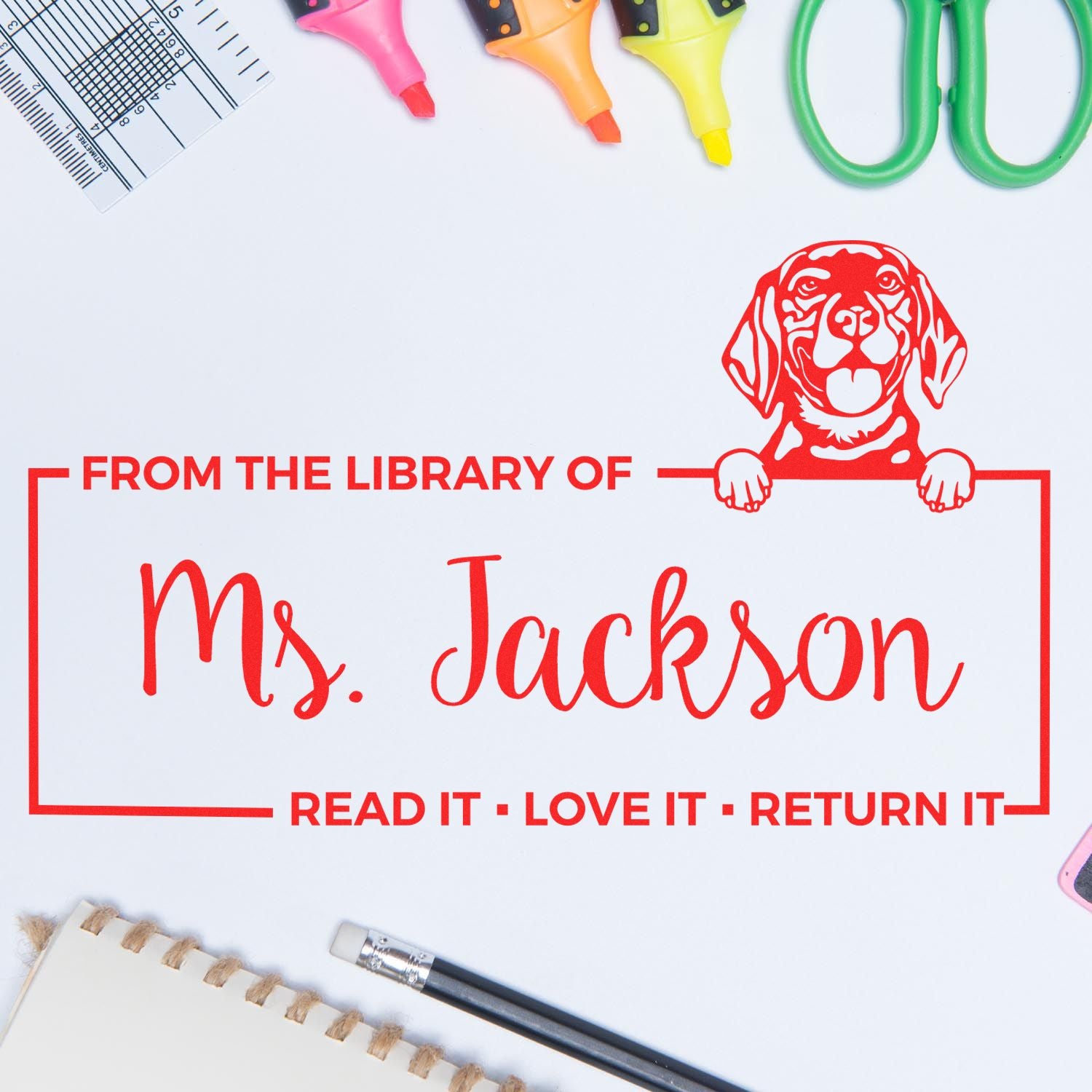 Personalized library book stamp for Ms. Jackson with dog design and Read it, love it, return it message.
