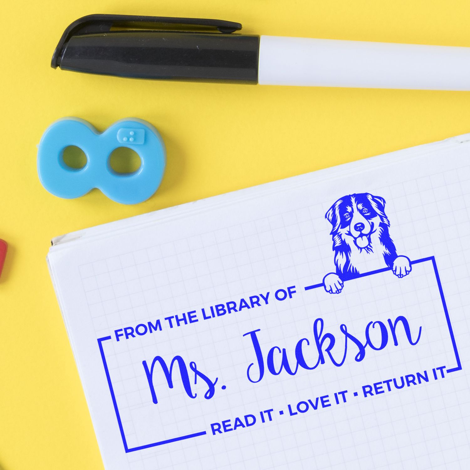 Custom library rubber stamp with From the Library of Ms. Jackson design for personalized book labeling and returns.