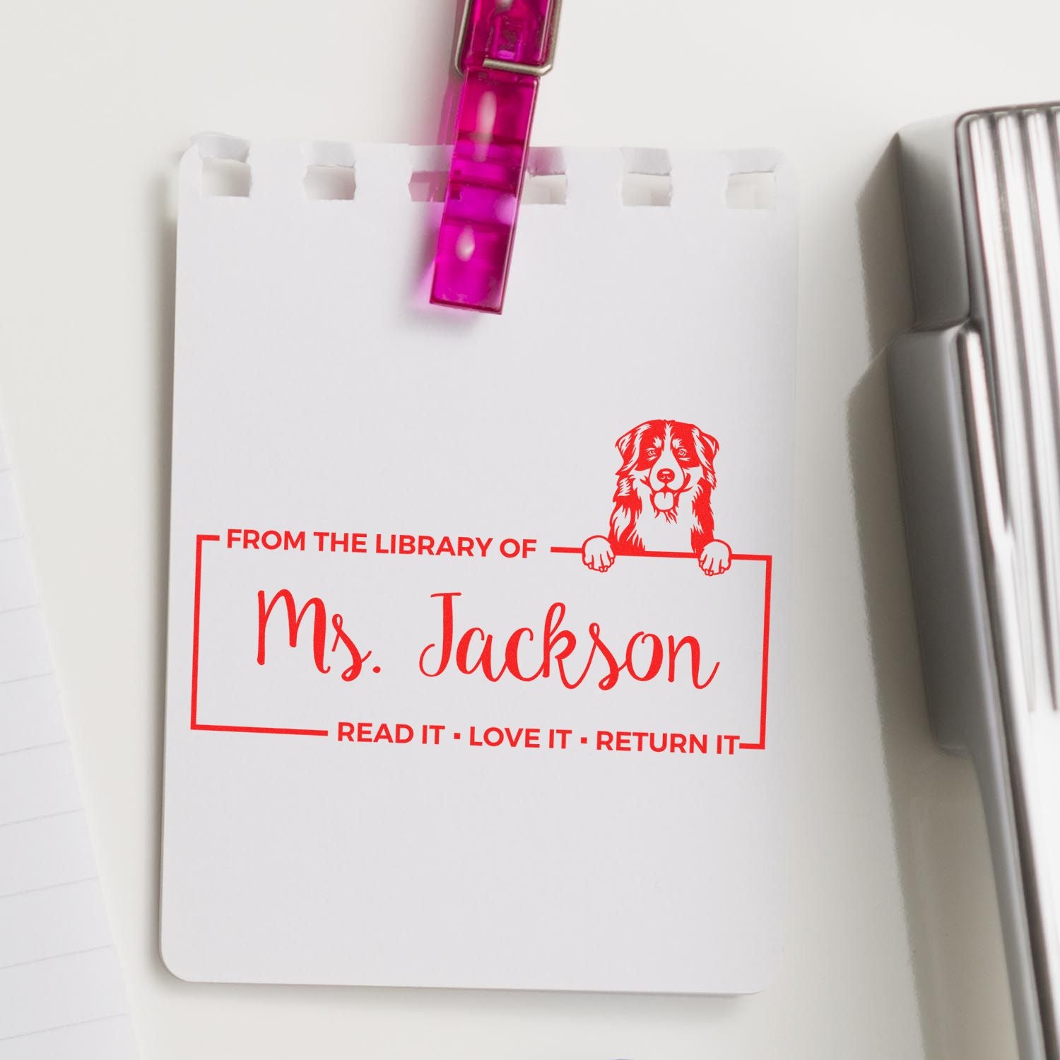 Custom library book rubber stamp for Ms. Jackson with dog design and Read it, love it, return it message.