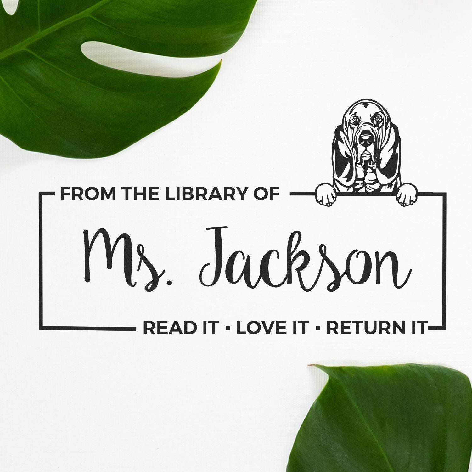 Custom rubber library book stamp for Ms. Jackson with dog design and Read it, love it, return it message.