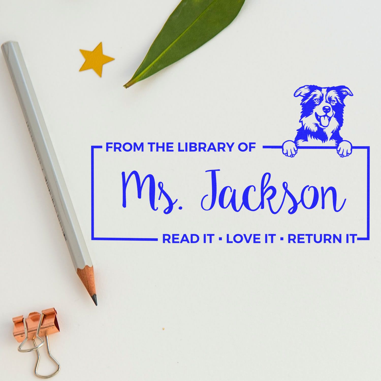 Custom library rubber stamp for Ms. Jackson with dog design and Read It, Love It, Return It book ownership text.
