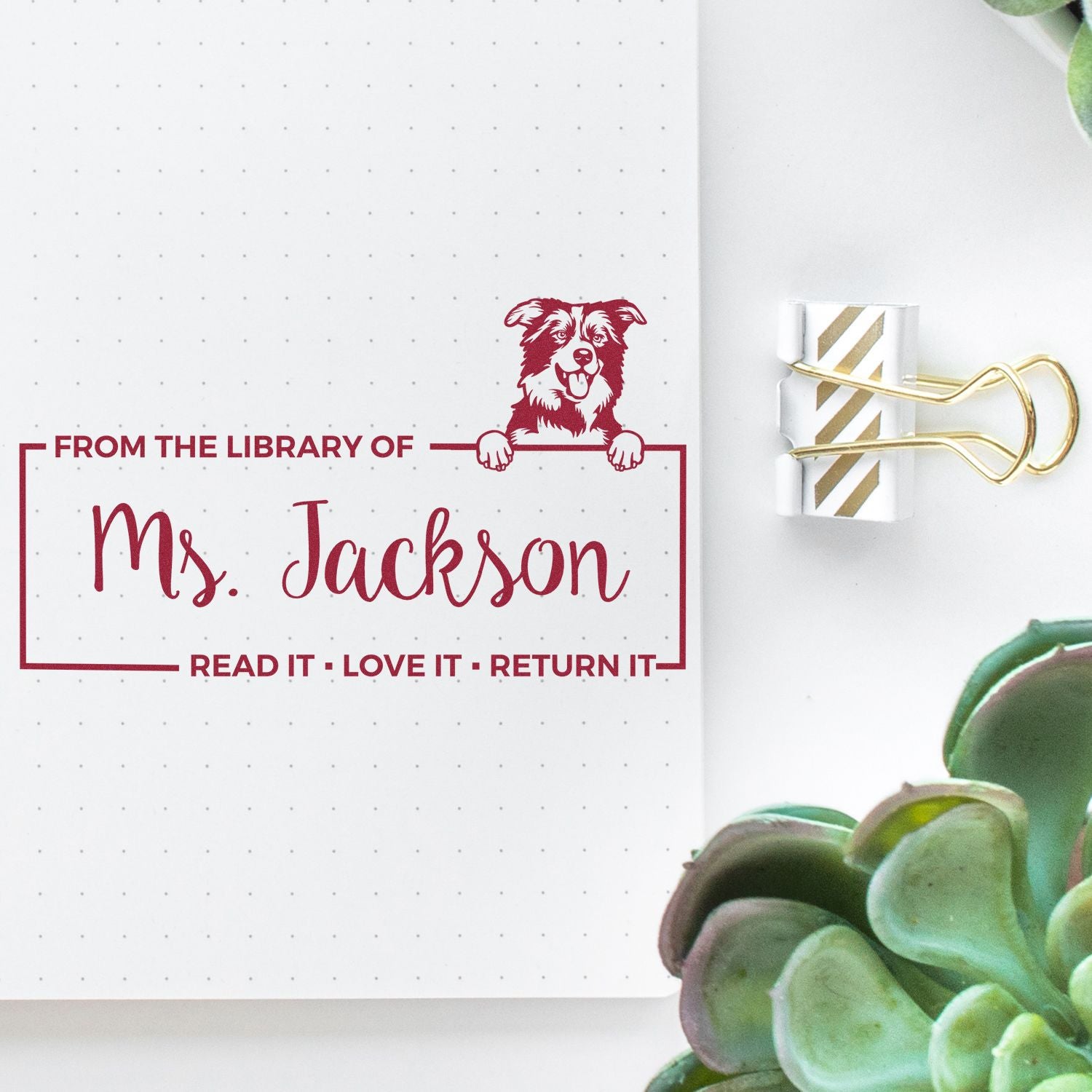 Custom rubber stamp reading From the Library of Ms. Jackson with dog design for personalized library book return labels.