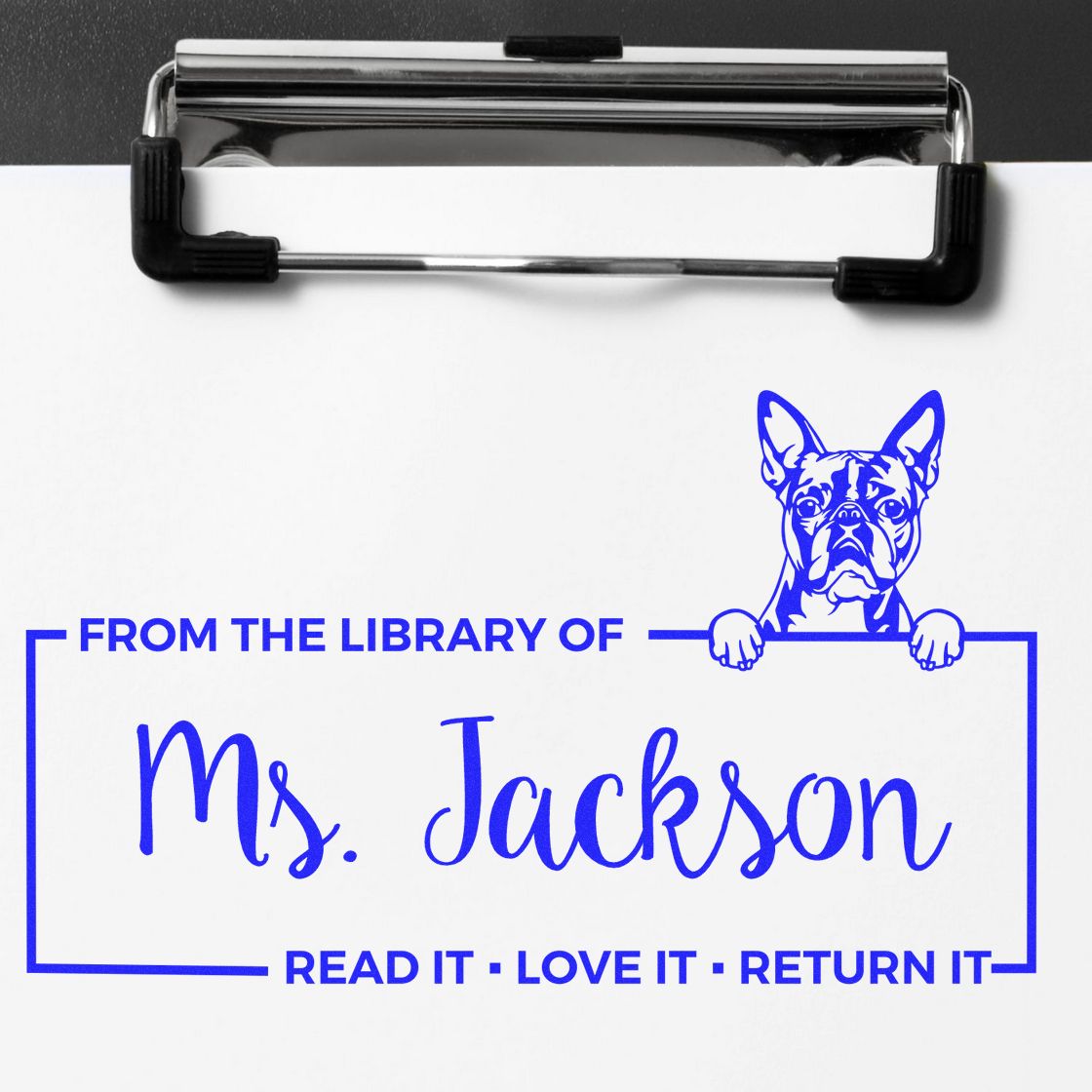 Personalized book library stamp for Mrs. Jackson with dog illustration and Read it, love it, return it lending message.